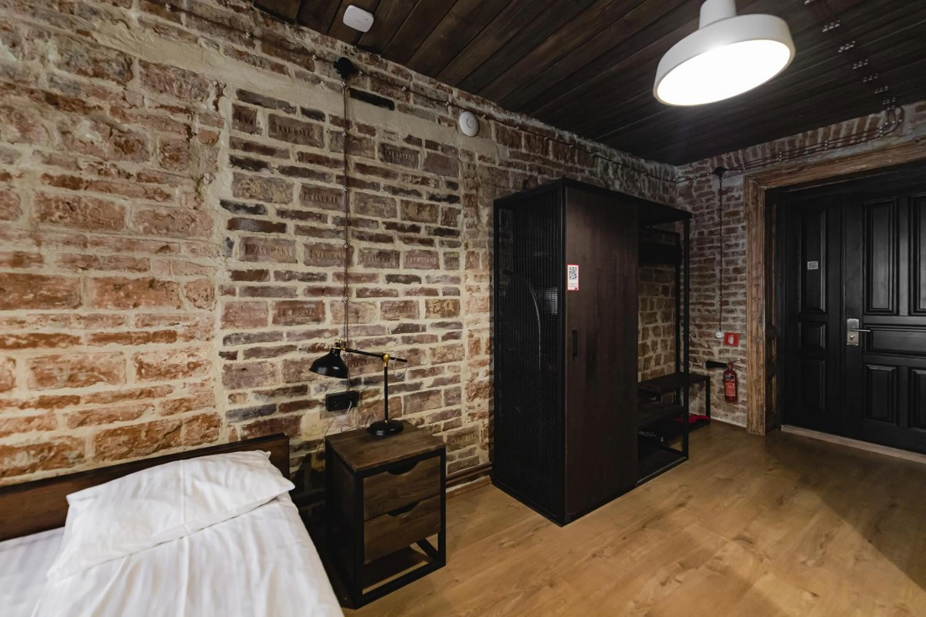 Bed in Apartments JustLvivIt at the Rynok Square
