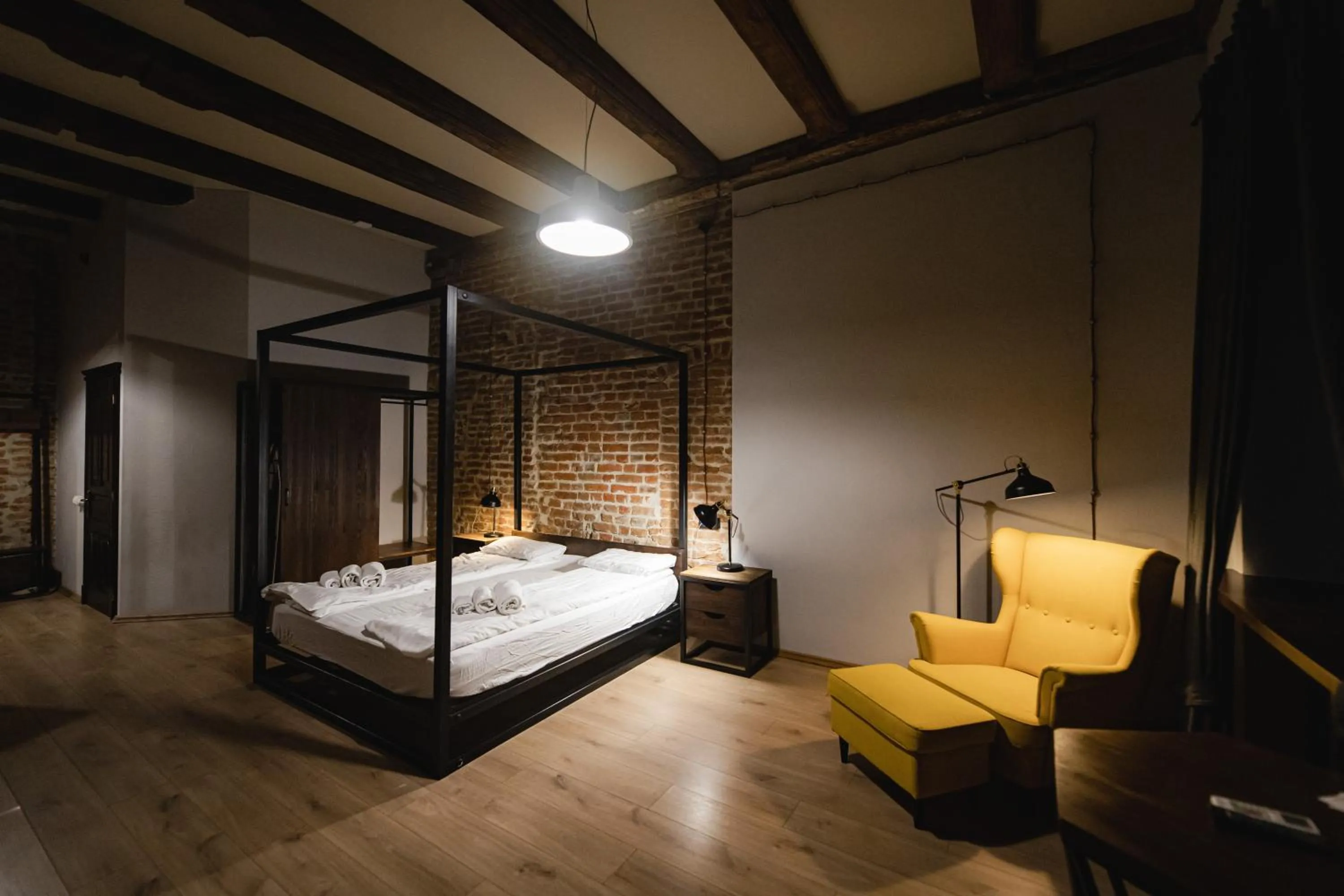 Bed in Apartments JustLvivIt at the Rynok Square