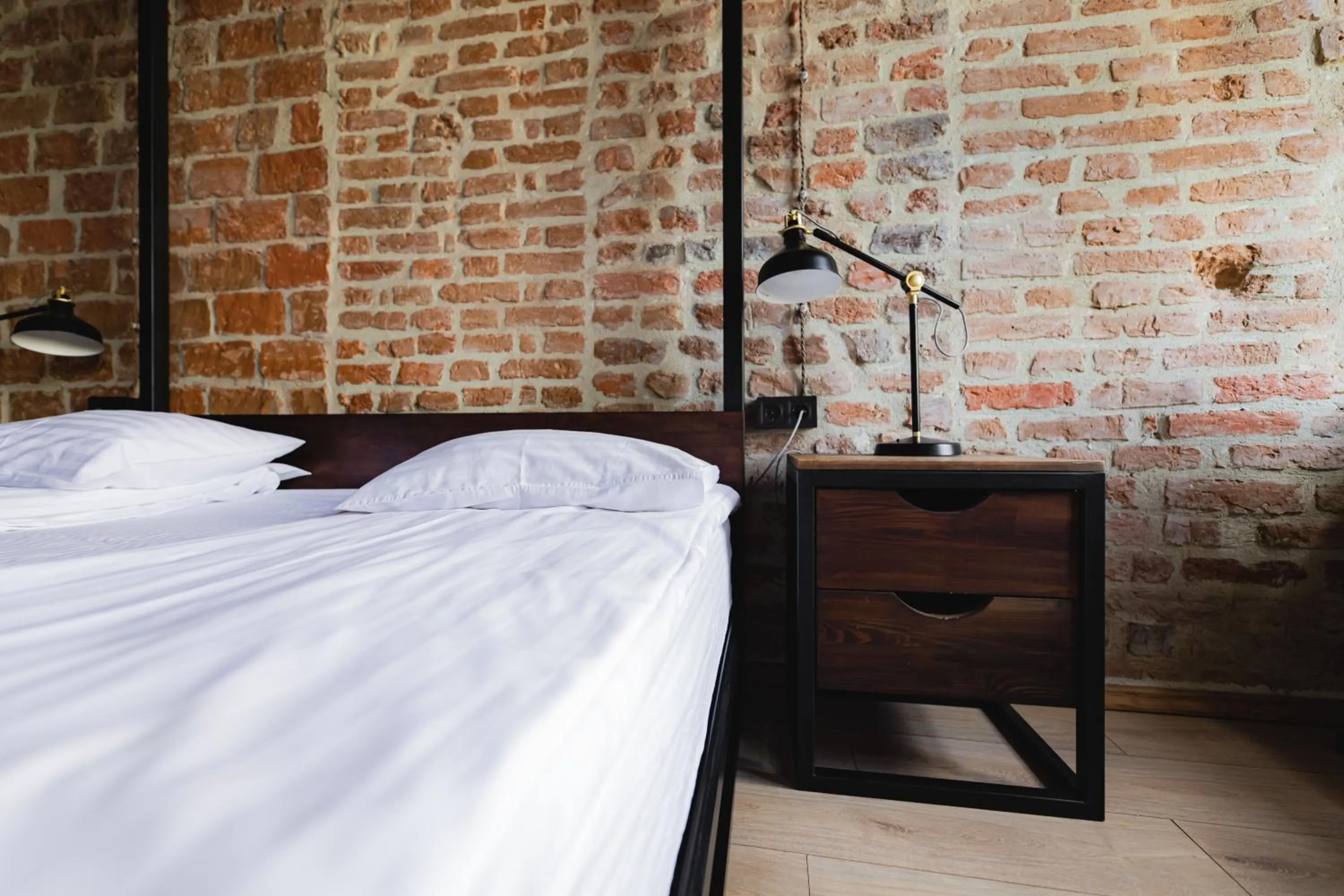 Bed in Apartments JustLvivIt at the Rynok Square