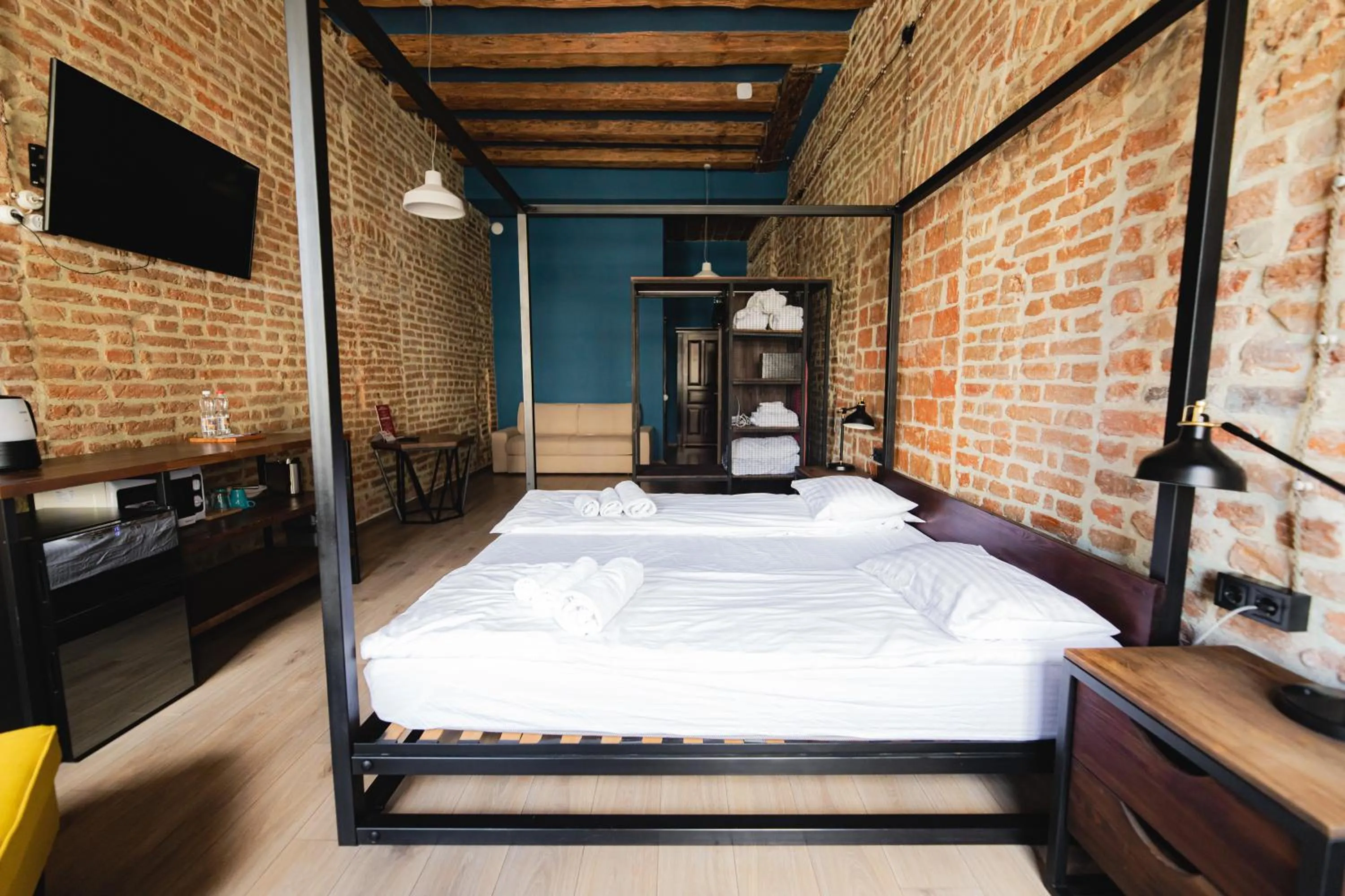 Bed in Apartments JustLvivIt at the Rynok Square