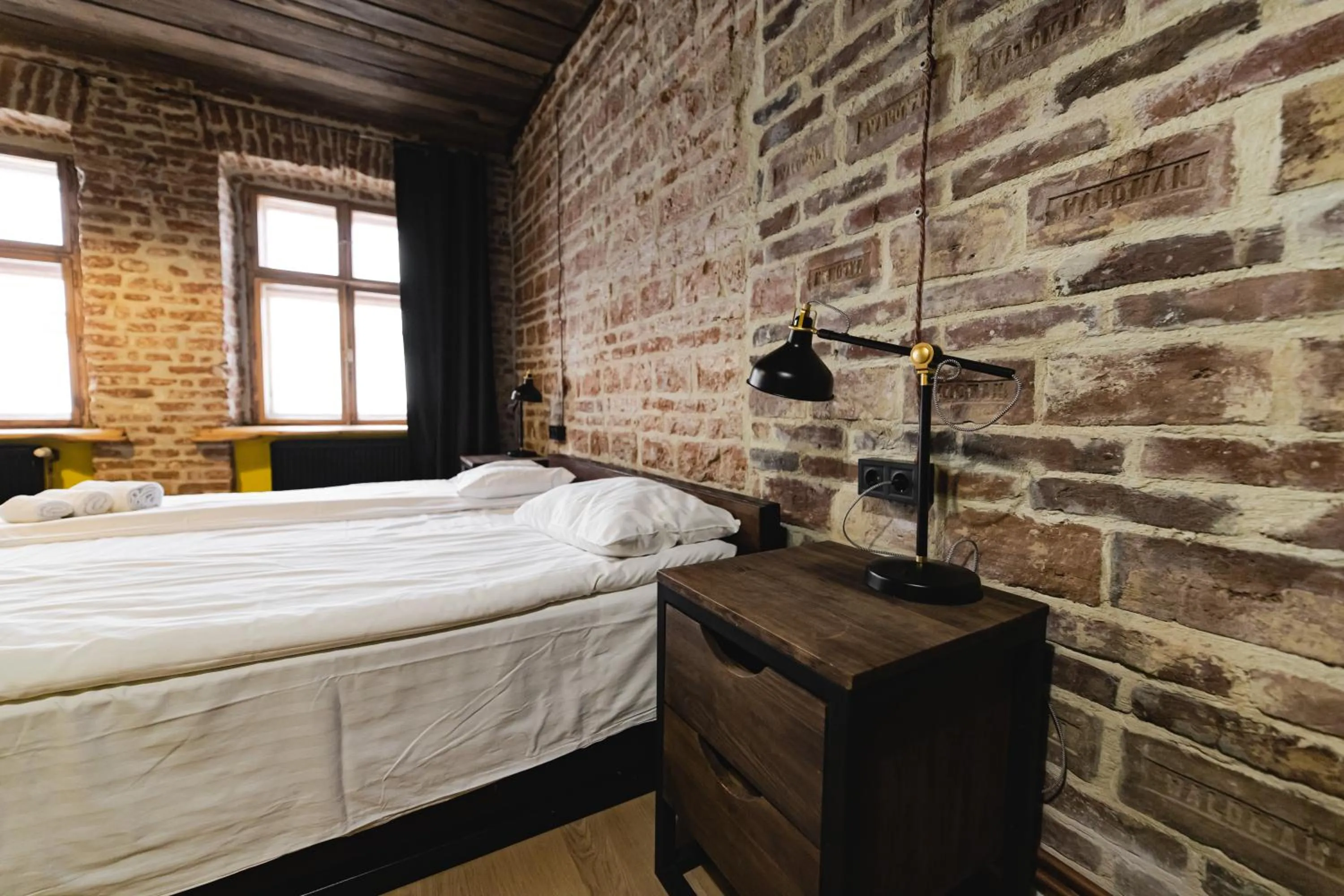 Bed in Apartments JustLvivIt at the Rynok Square