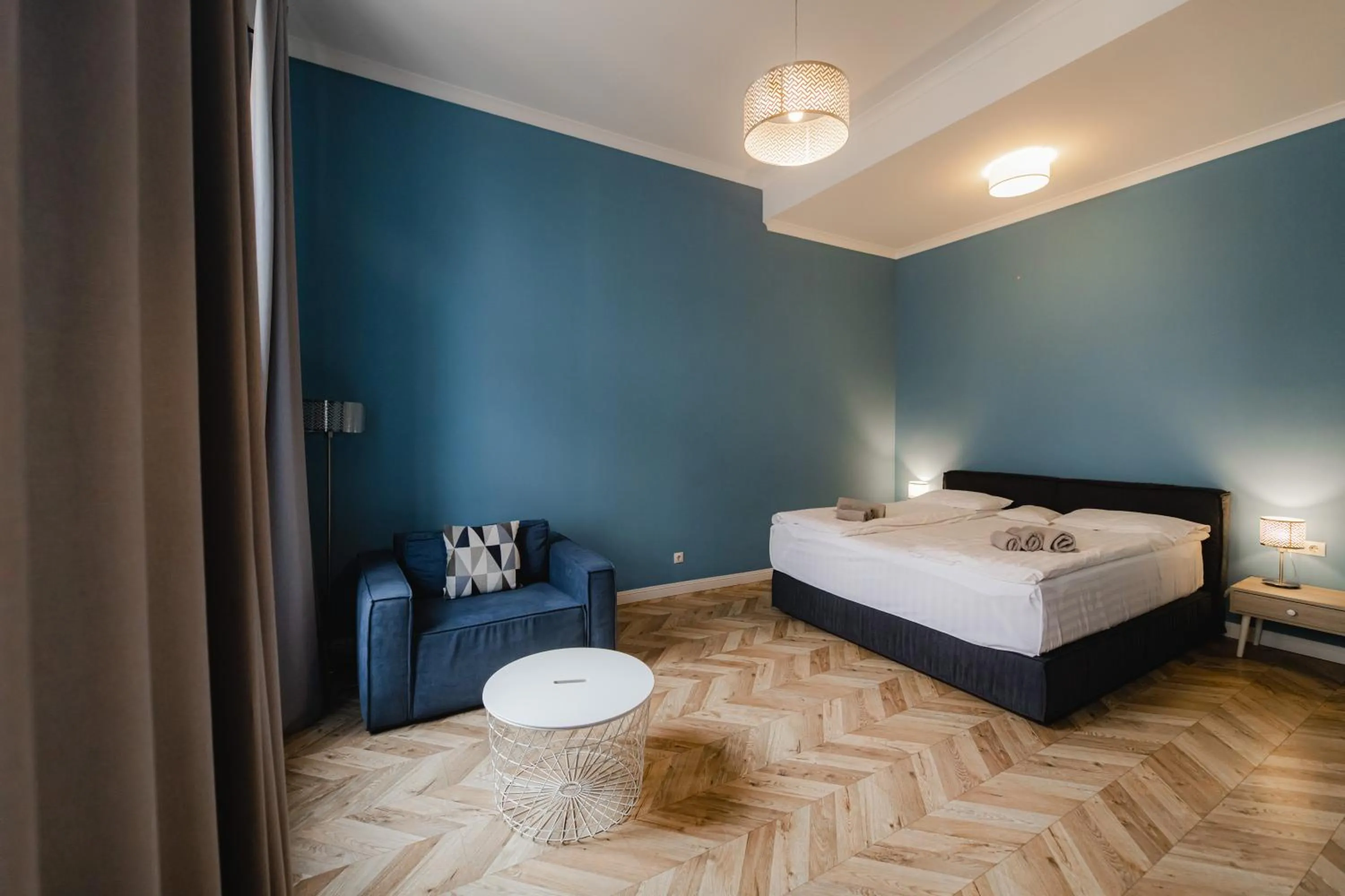 Bed in Apartments JustLvivIt at the Rynok Square