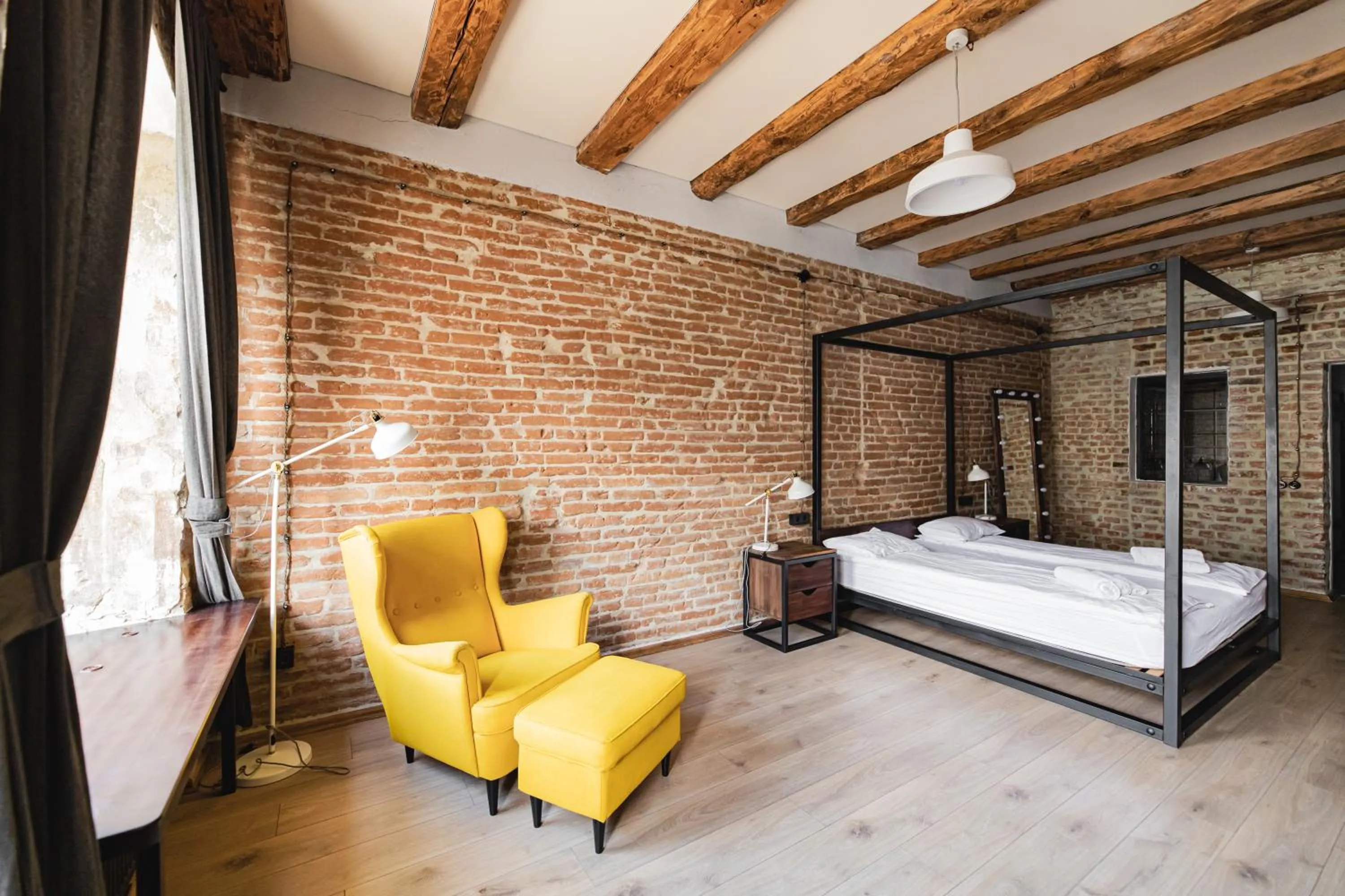 Bed in Apartments JustLvivIt at the Rynok Square