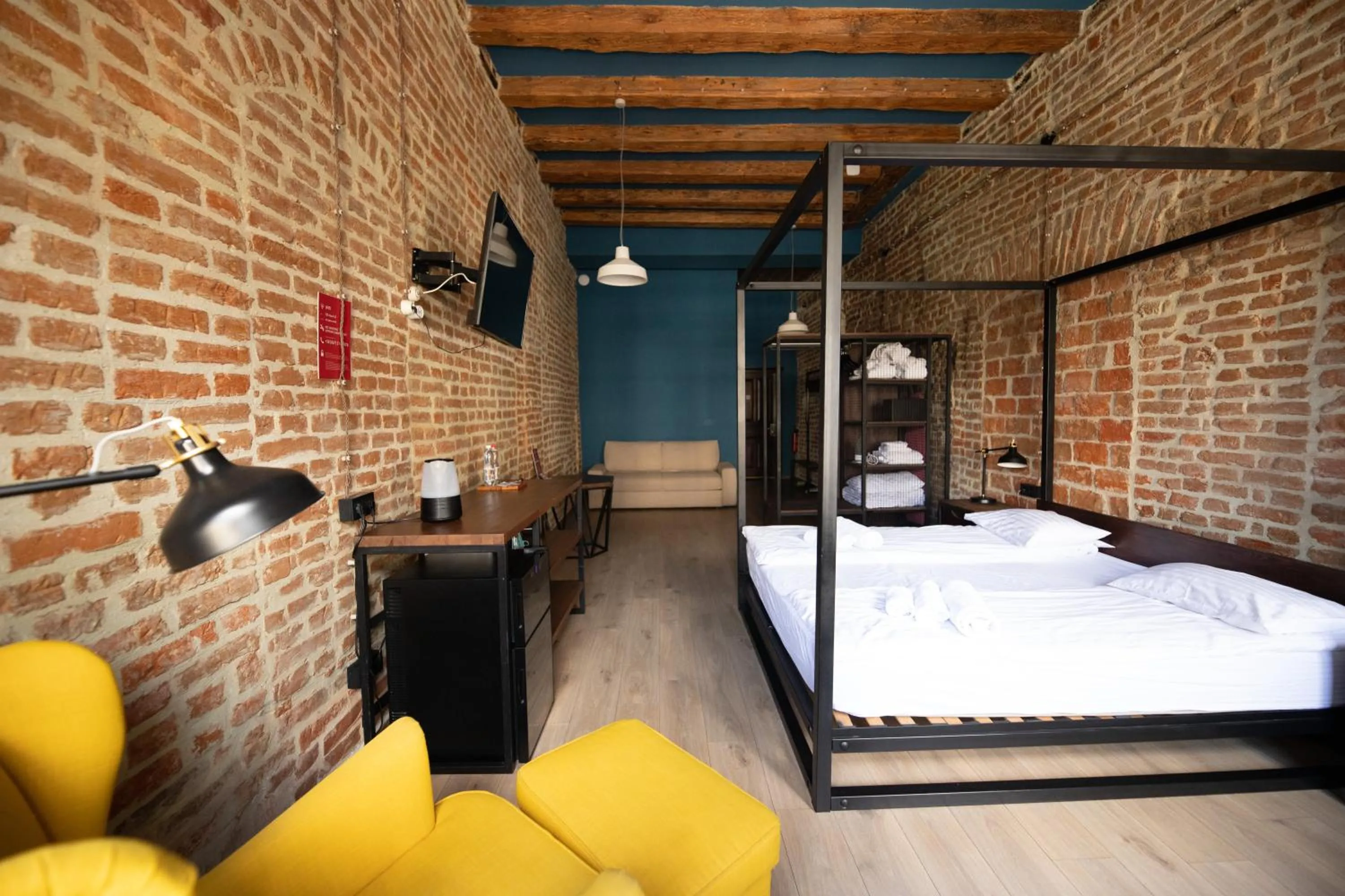Bed in Apartments JustLvivIt at the Rynok Square