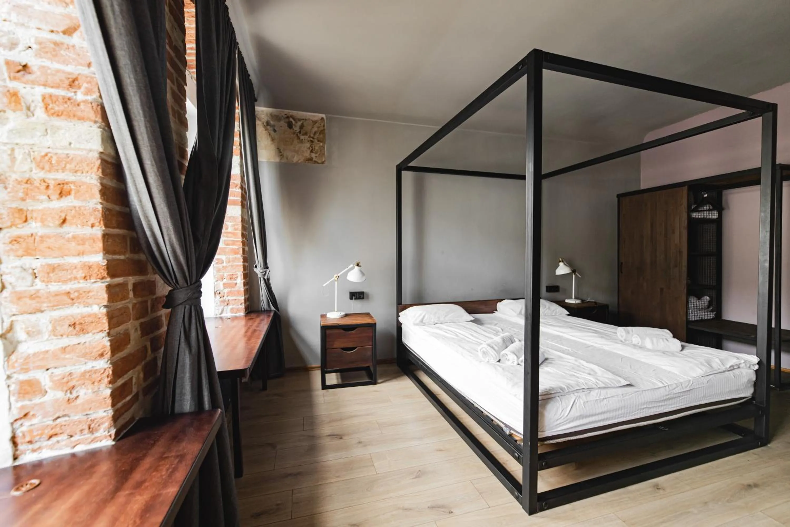 Bed in Apartments JustLvivIt at the Rynok Square