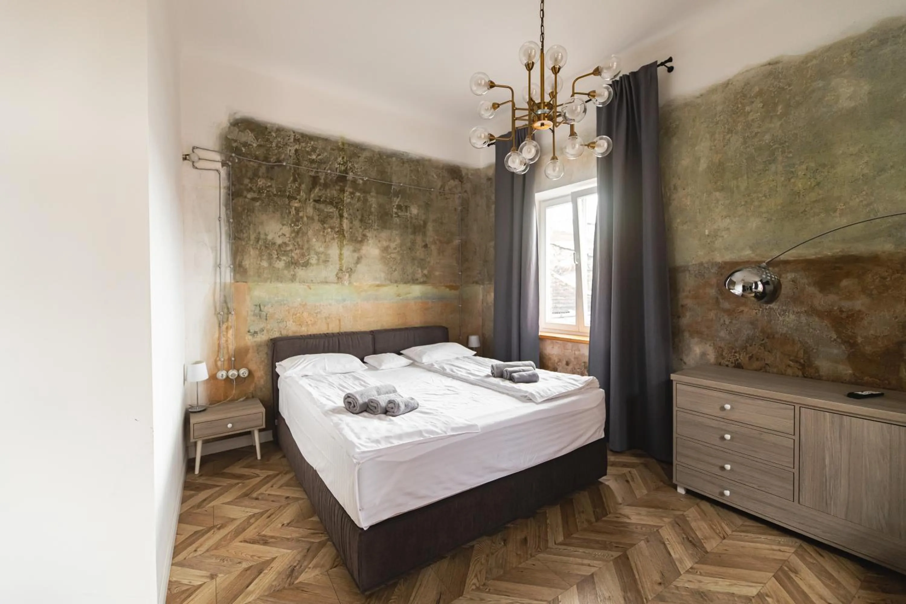 Bed in Apartments JustLvivIt at the Rynok Square