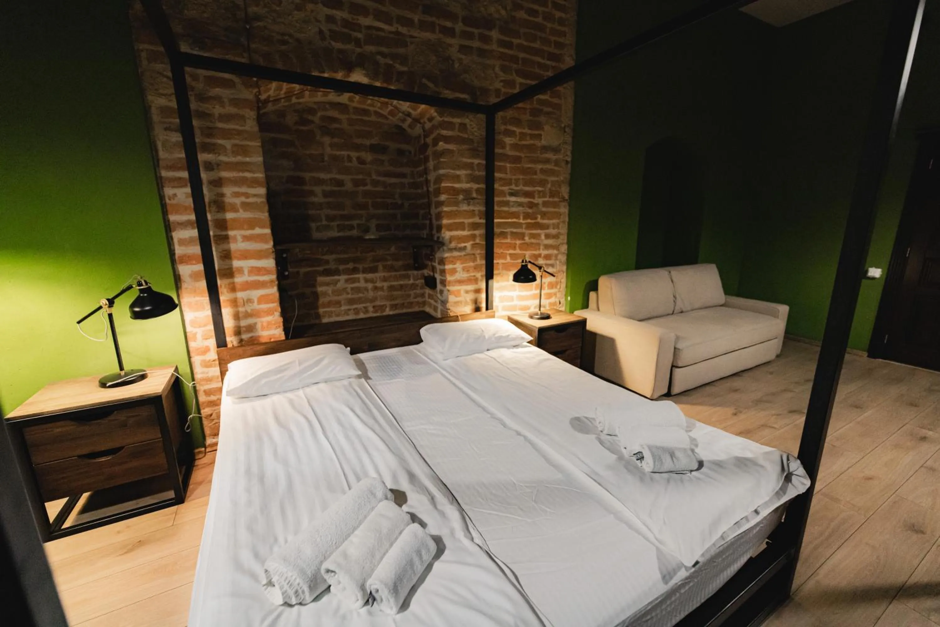 Bed in Apartments JustLvivIt at the Rynok Square