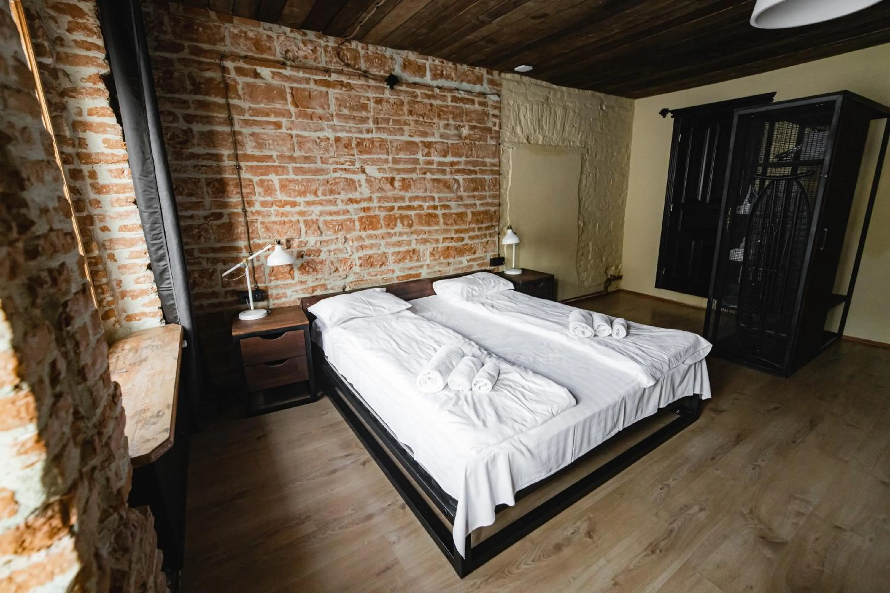 Bed in Apartments JustLvivIt at the Rynok Square