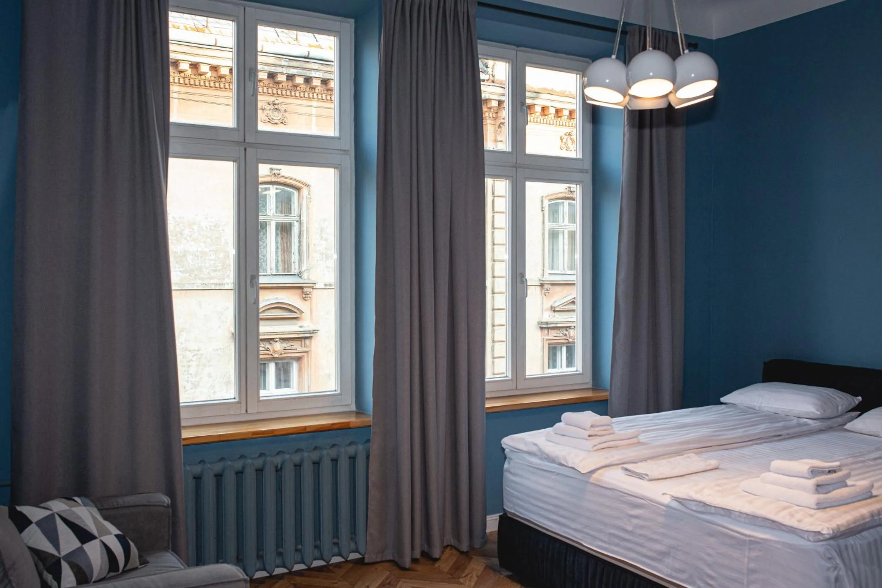 Bed in Apartments JustLvivIt at the Rynok Square
