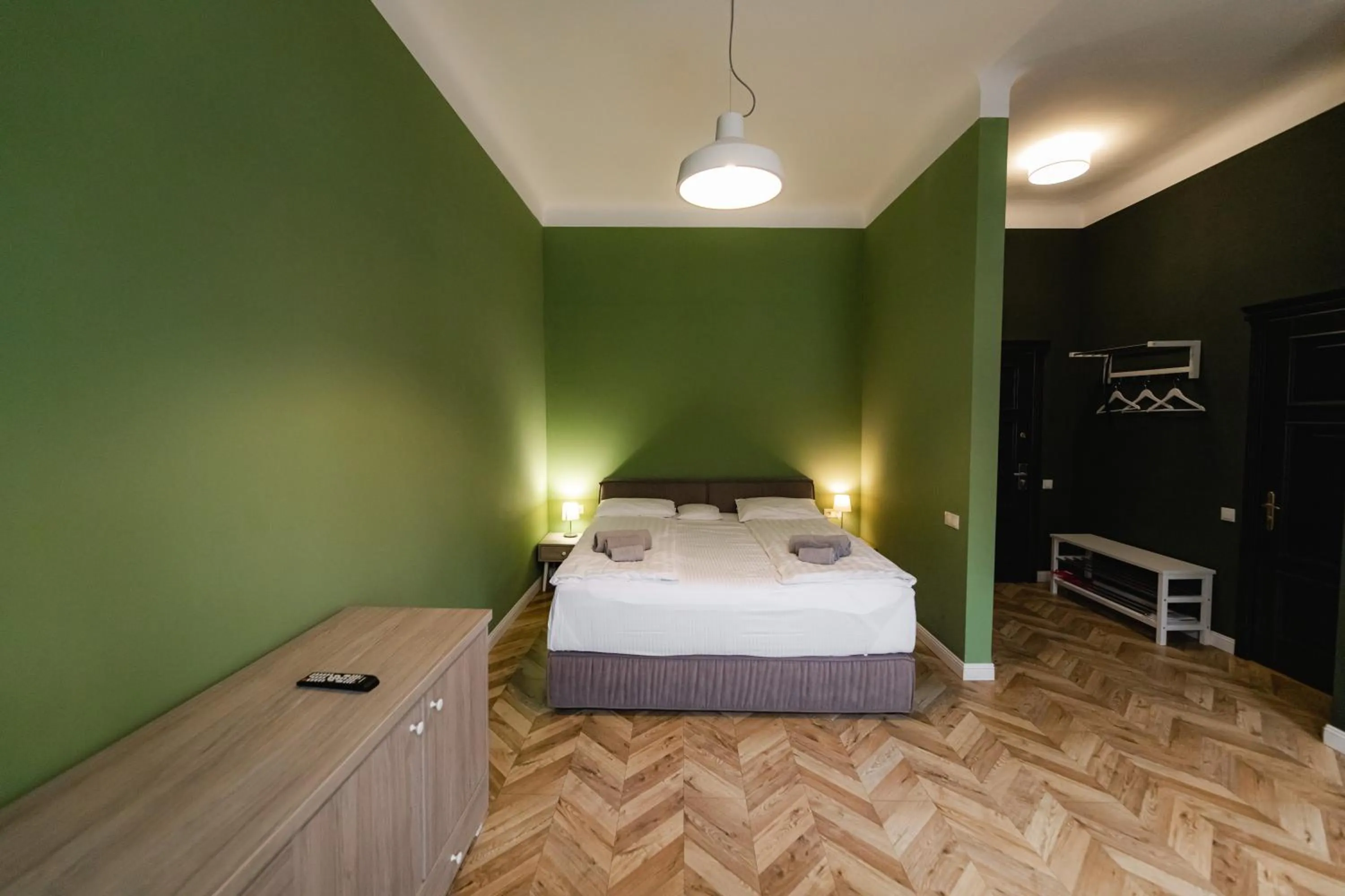 Bed in Apartments JustLvivIt at the Rynok Square