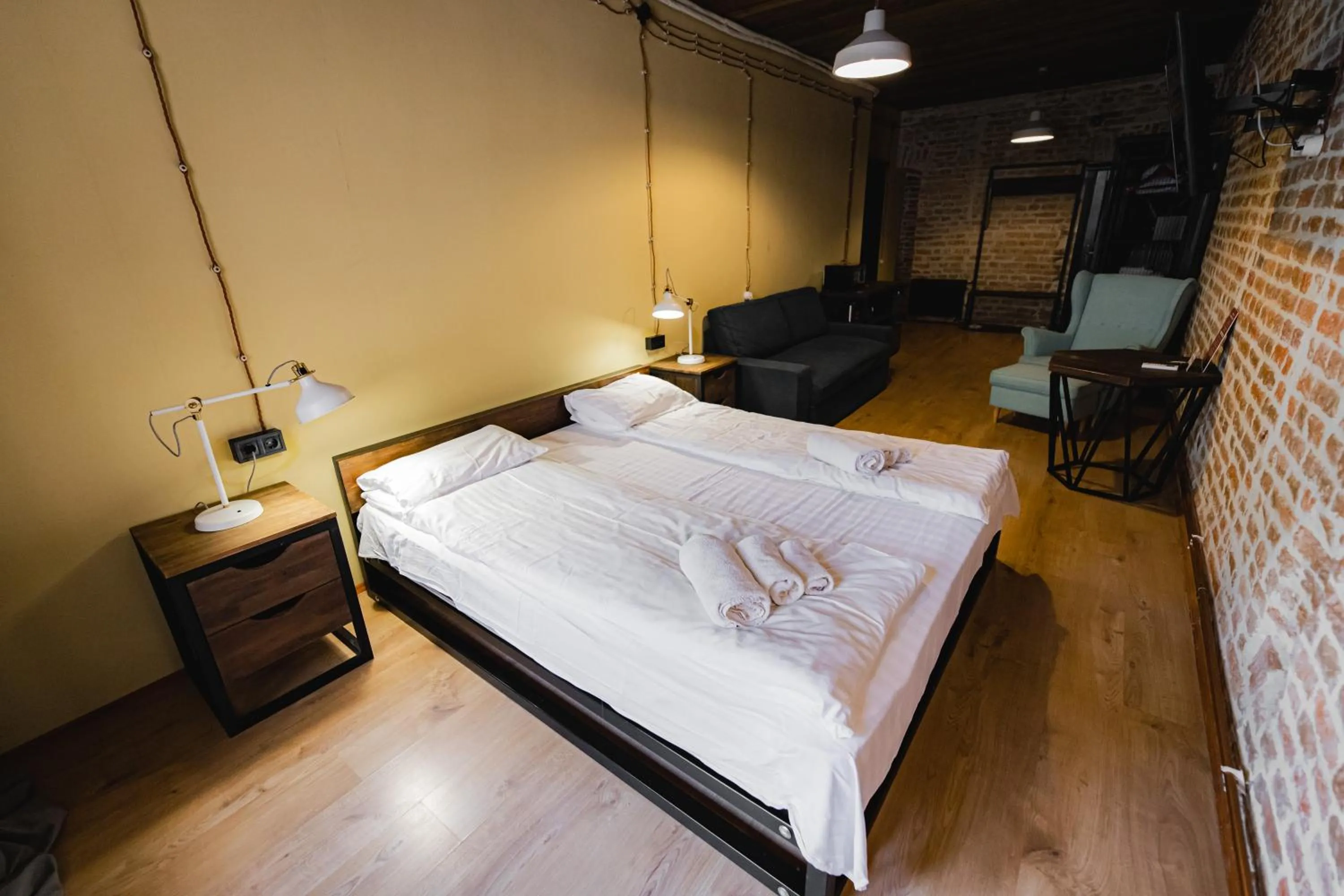 Bed in Apartments JustLvivIt at the Rynok Square