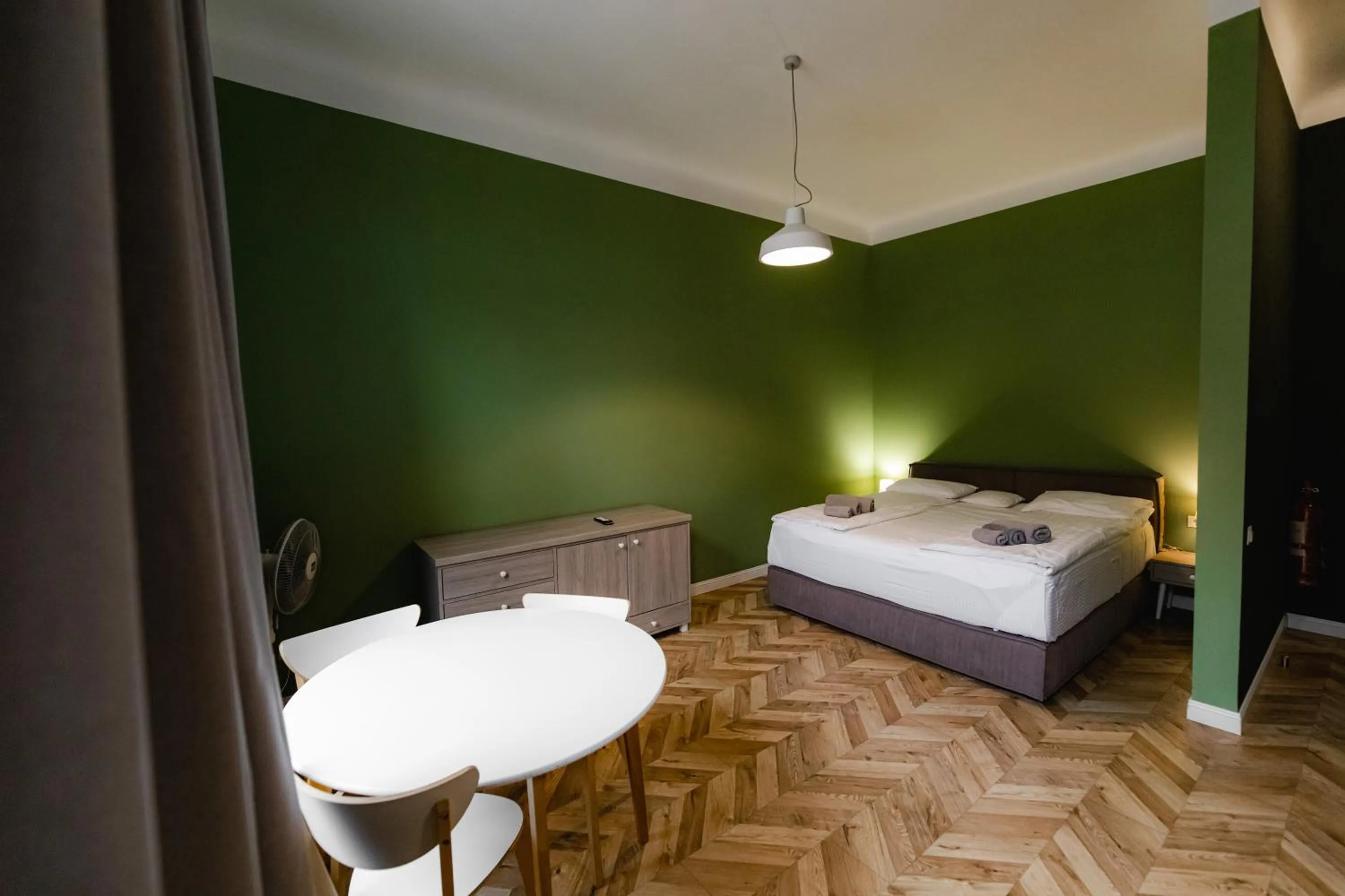 Bed in Apartments JustLvivIt at the Rynok Square