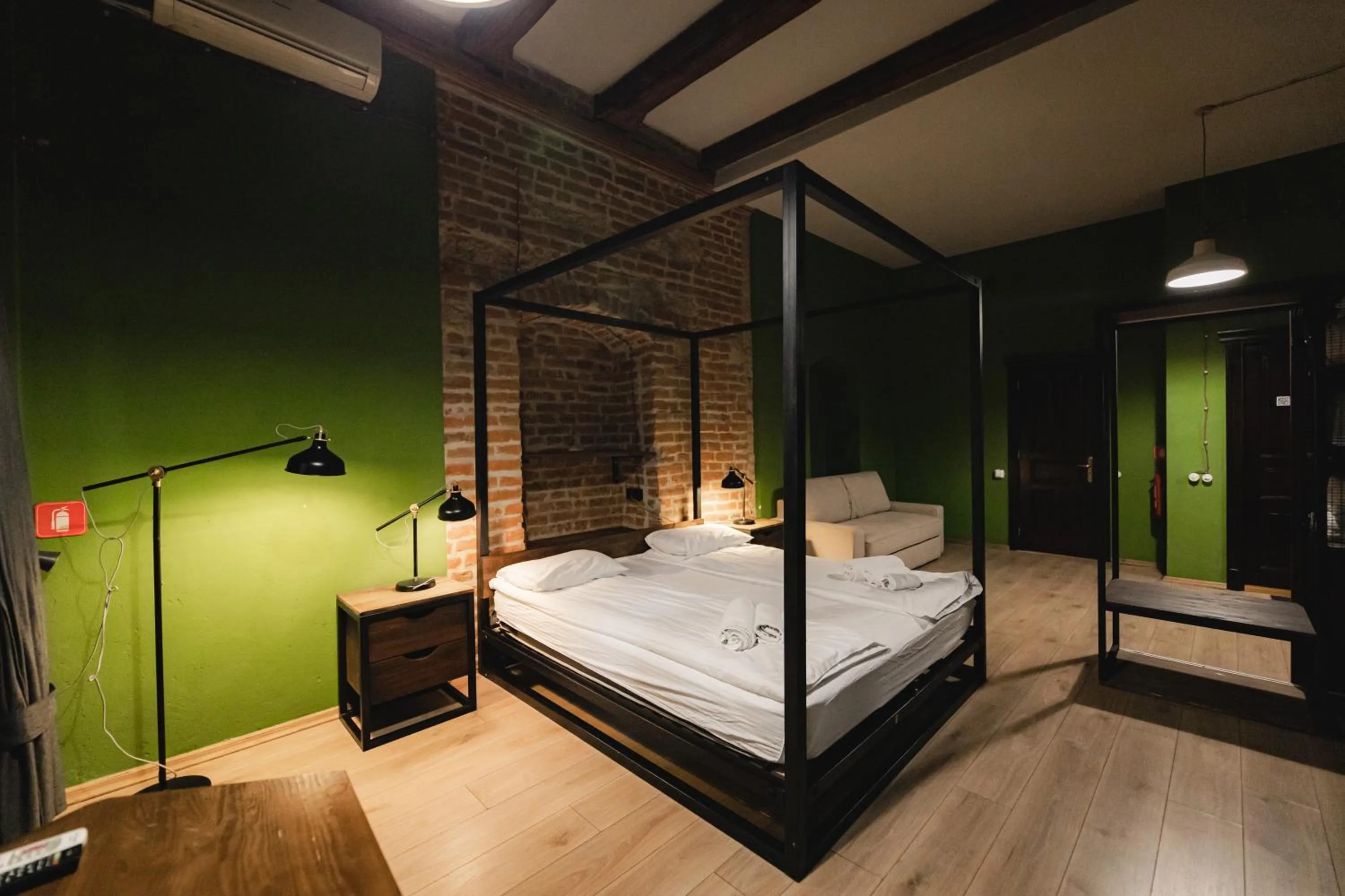 Bed in Apartments JustLvivIt at the Rynok Square