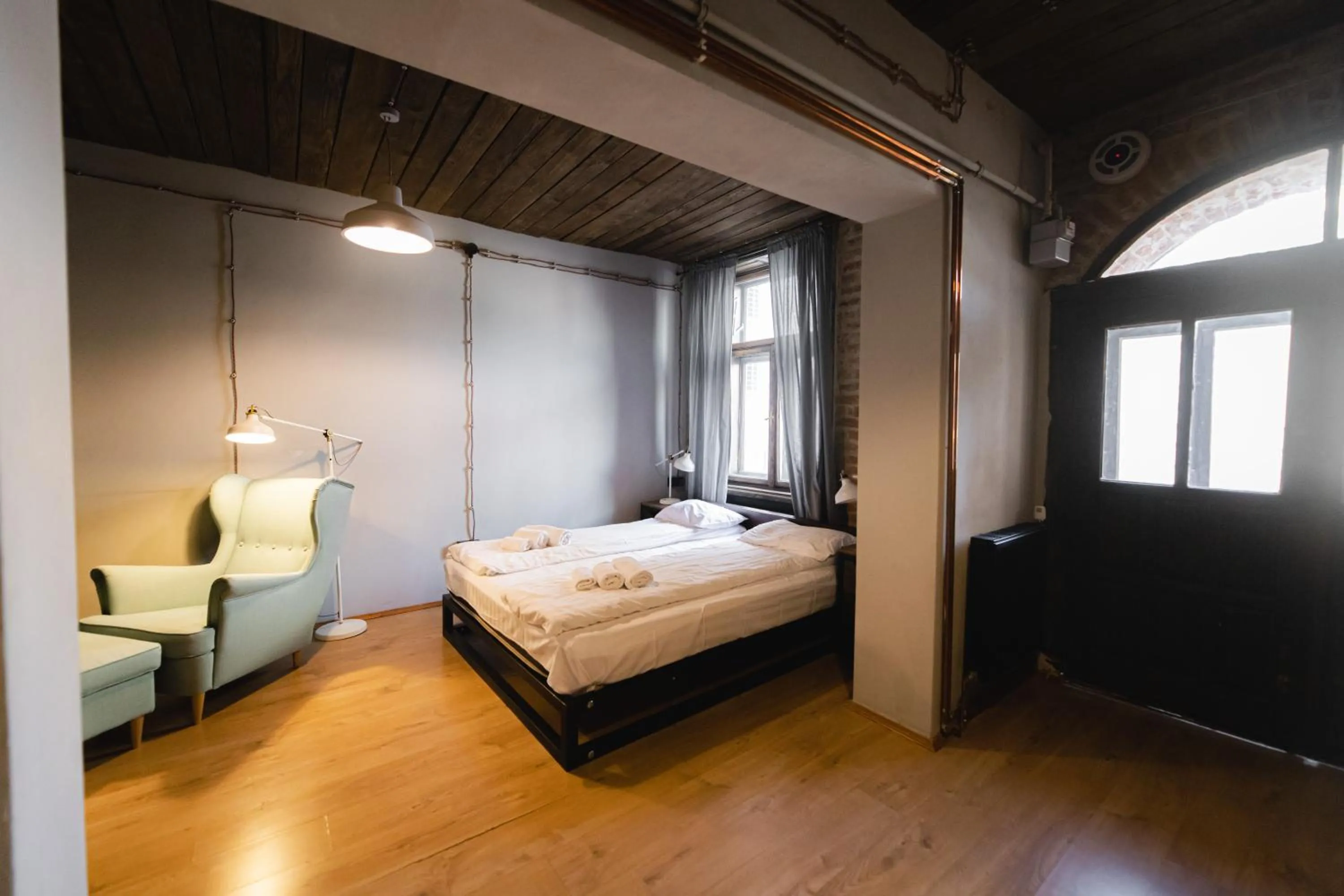 Bed in Apartments JustLvivIt at the Rynok Square