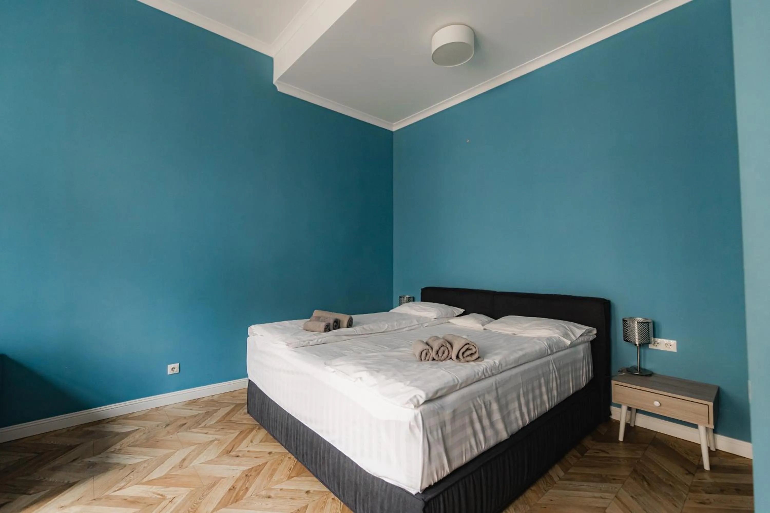 Bed in Apartments JustLvivIt at the Rynok Square