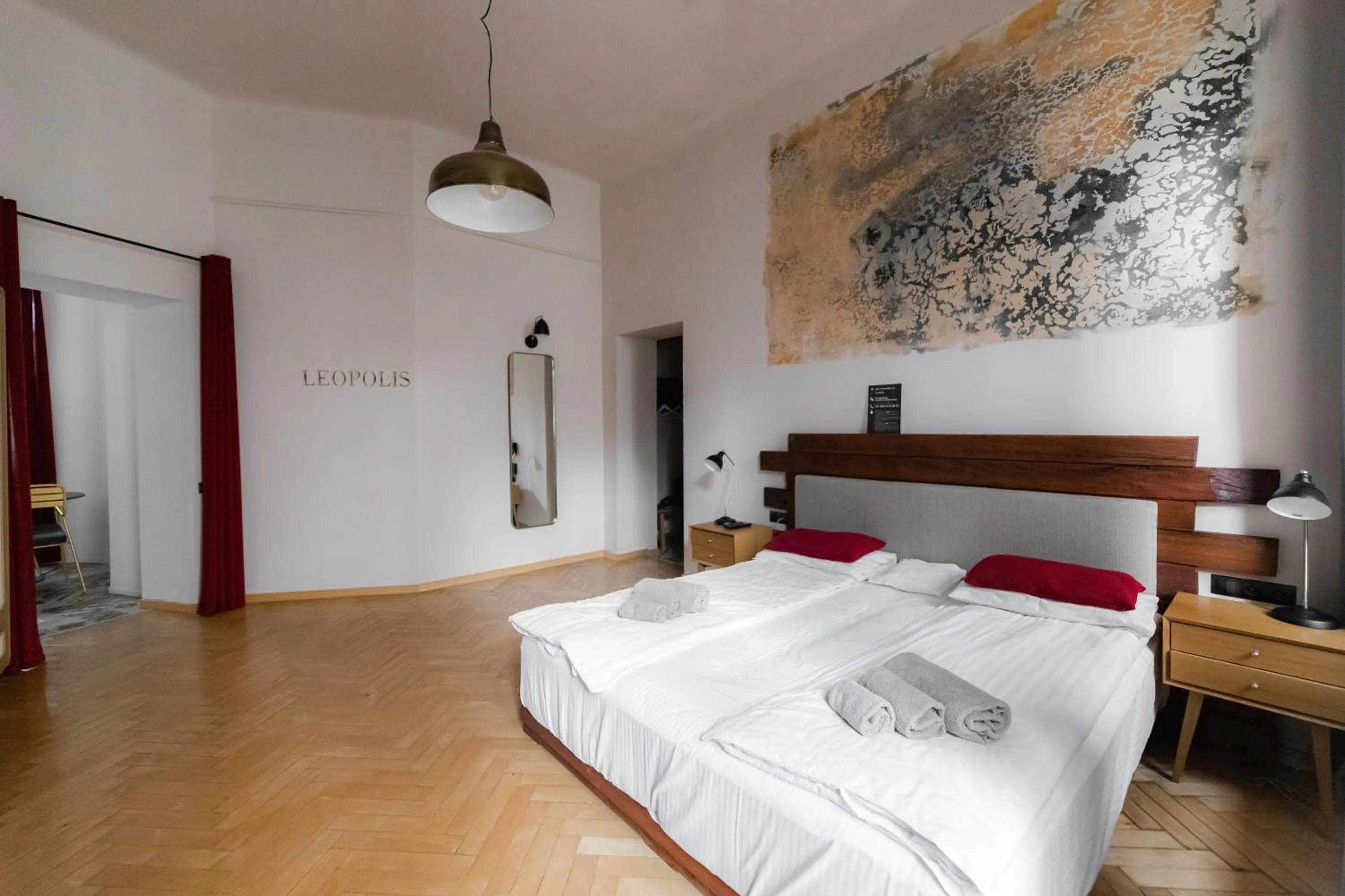 Bed in Apartments JustLvivIt at the Rynok Square