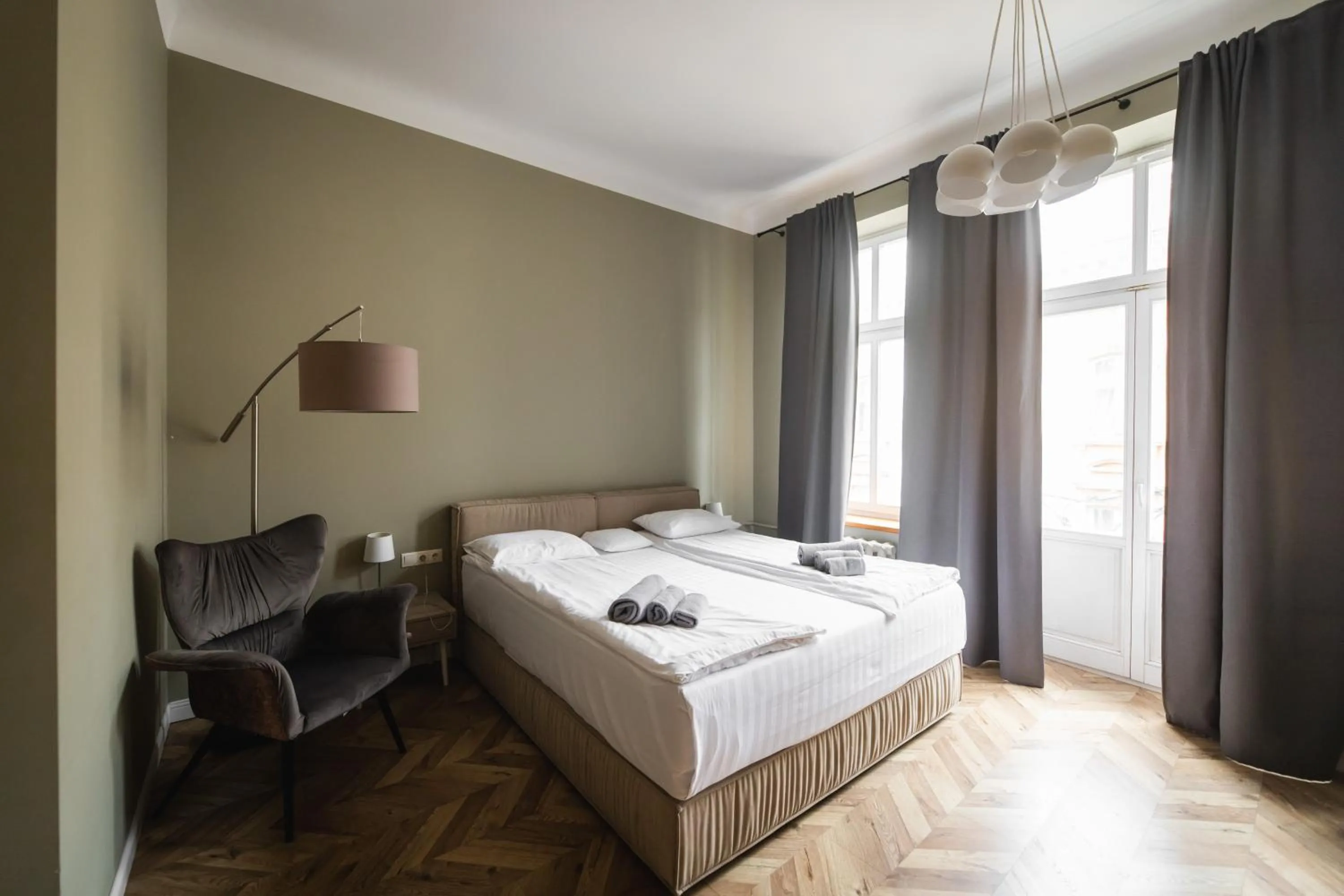 Bed in Apartments JustLvivIt at the Rynok Square