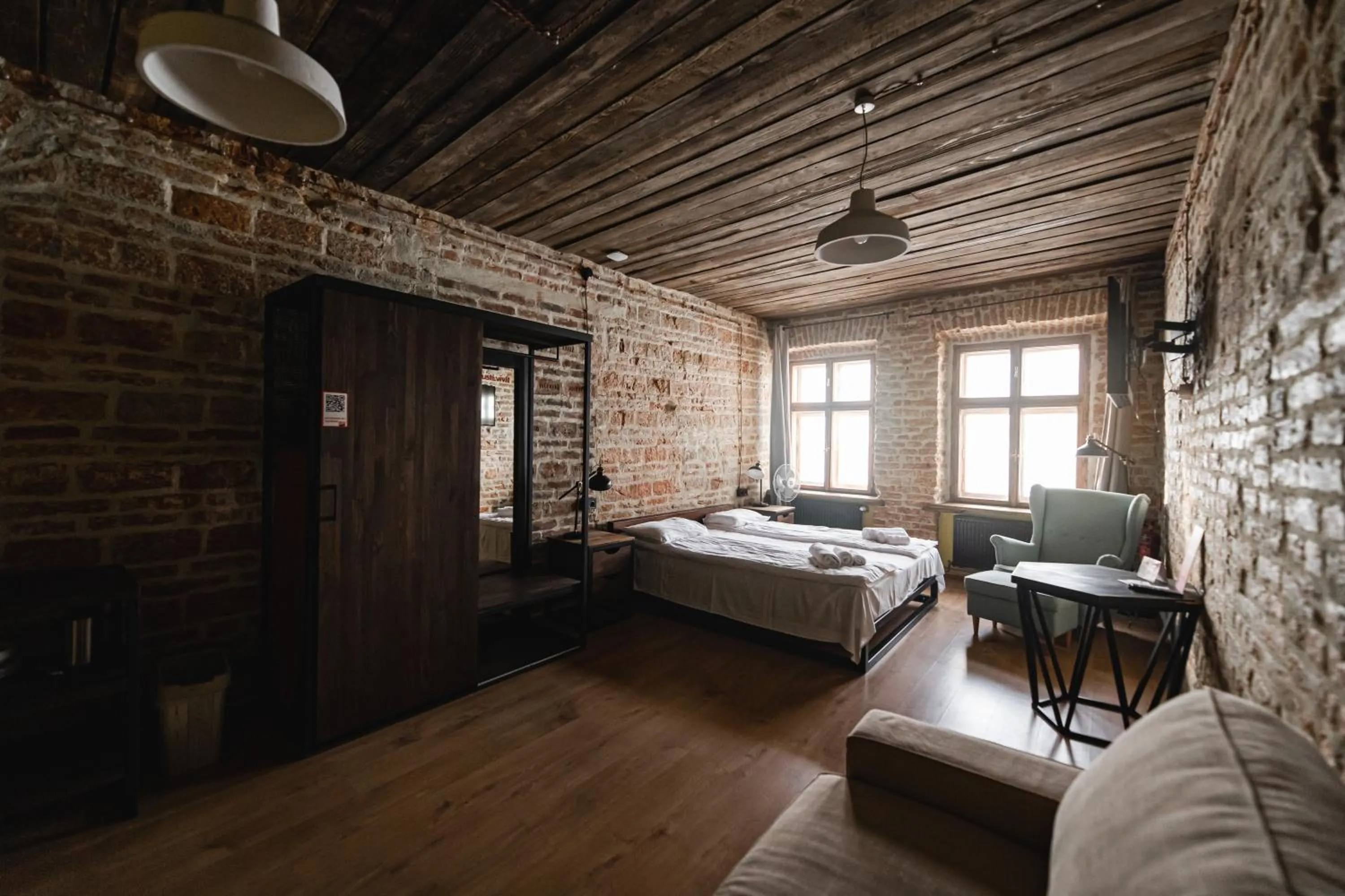 Bed in Apartments JustLvivIt at the Rynok Square