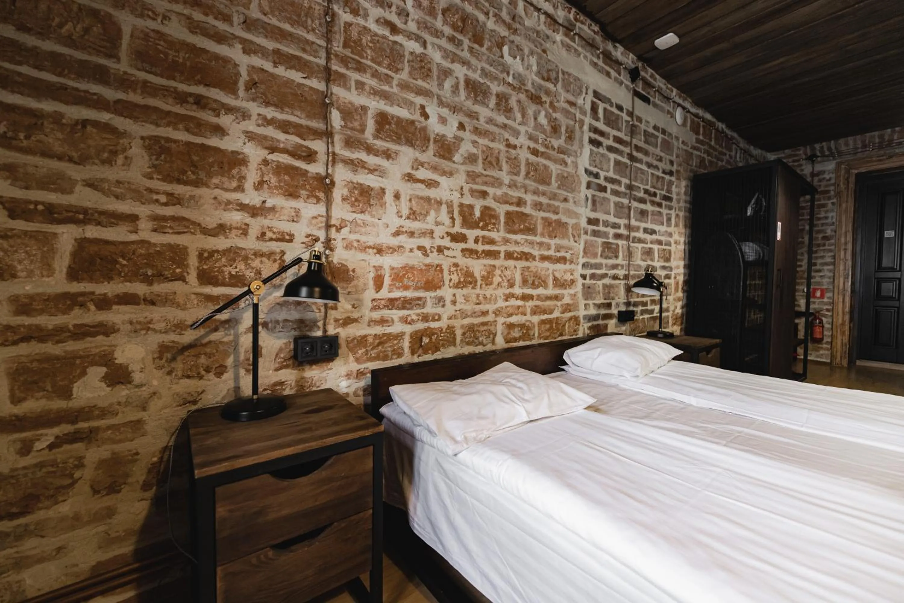Bed in Apartments JustLvivIt at the Rynok Square