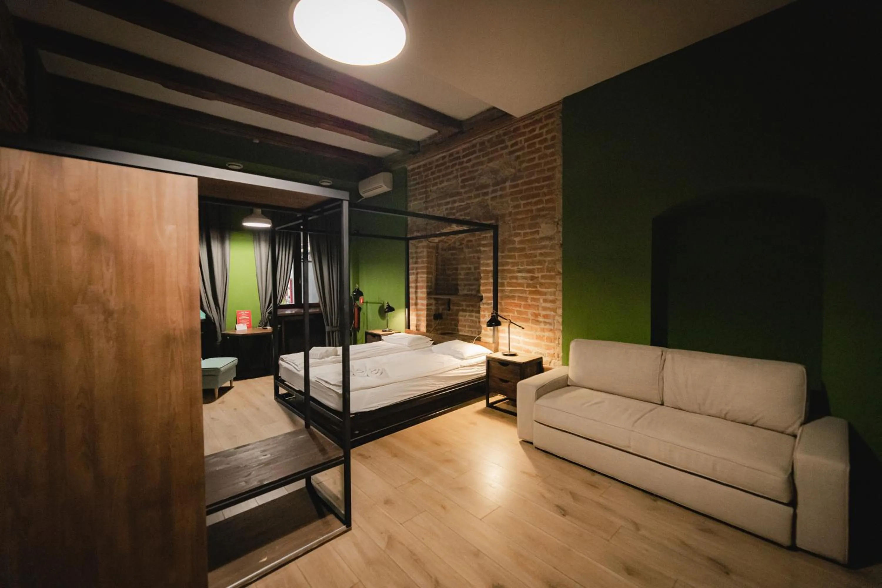 Bed in Apartments JustLvivIt at the Rynok Square