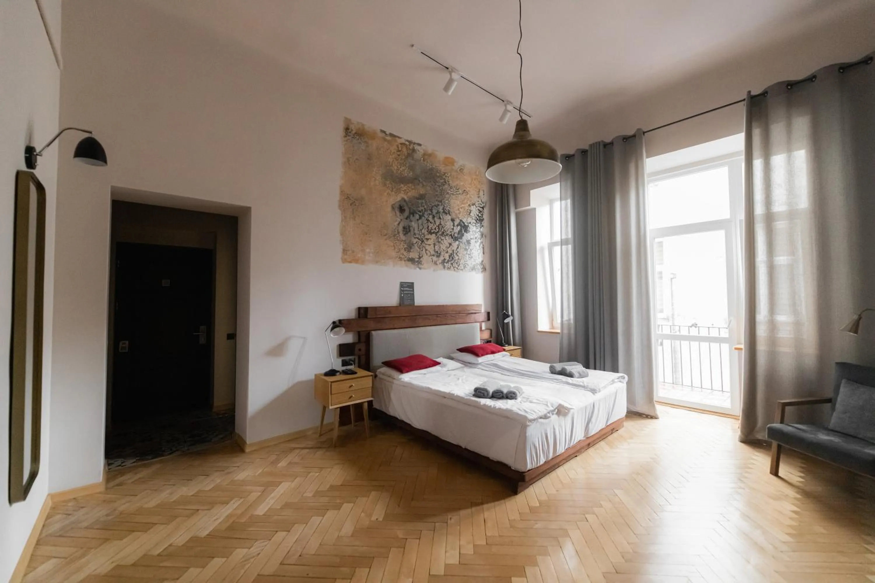 Bed in Apartments JustLvivIt at the Rynok Square