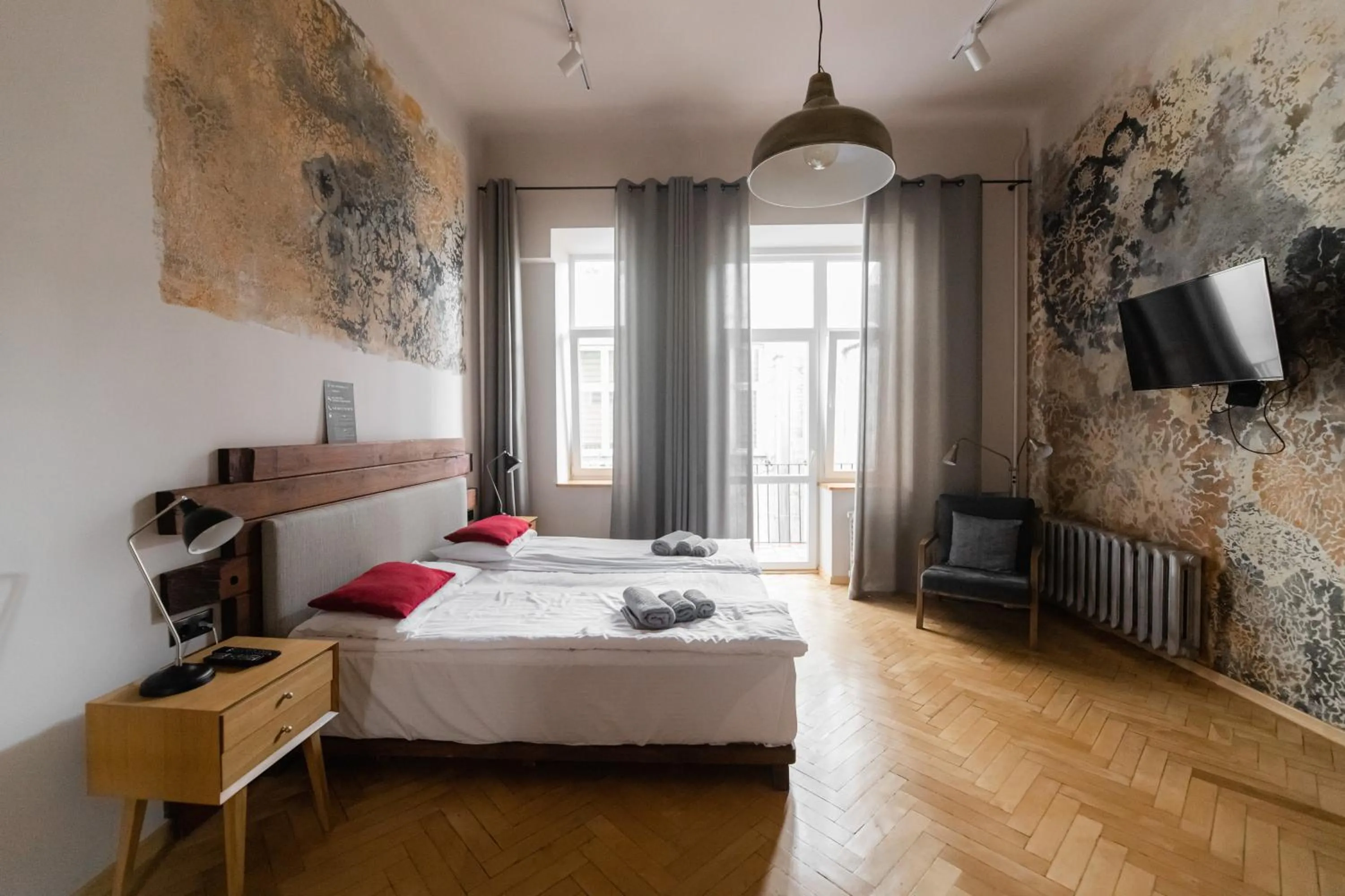Bed in Apartments JustLvivIt at the Rynok Square