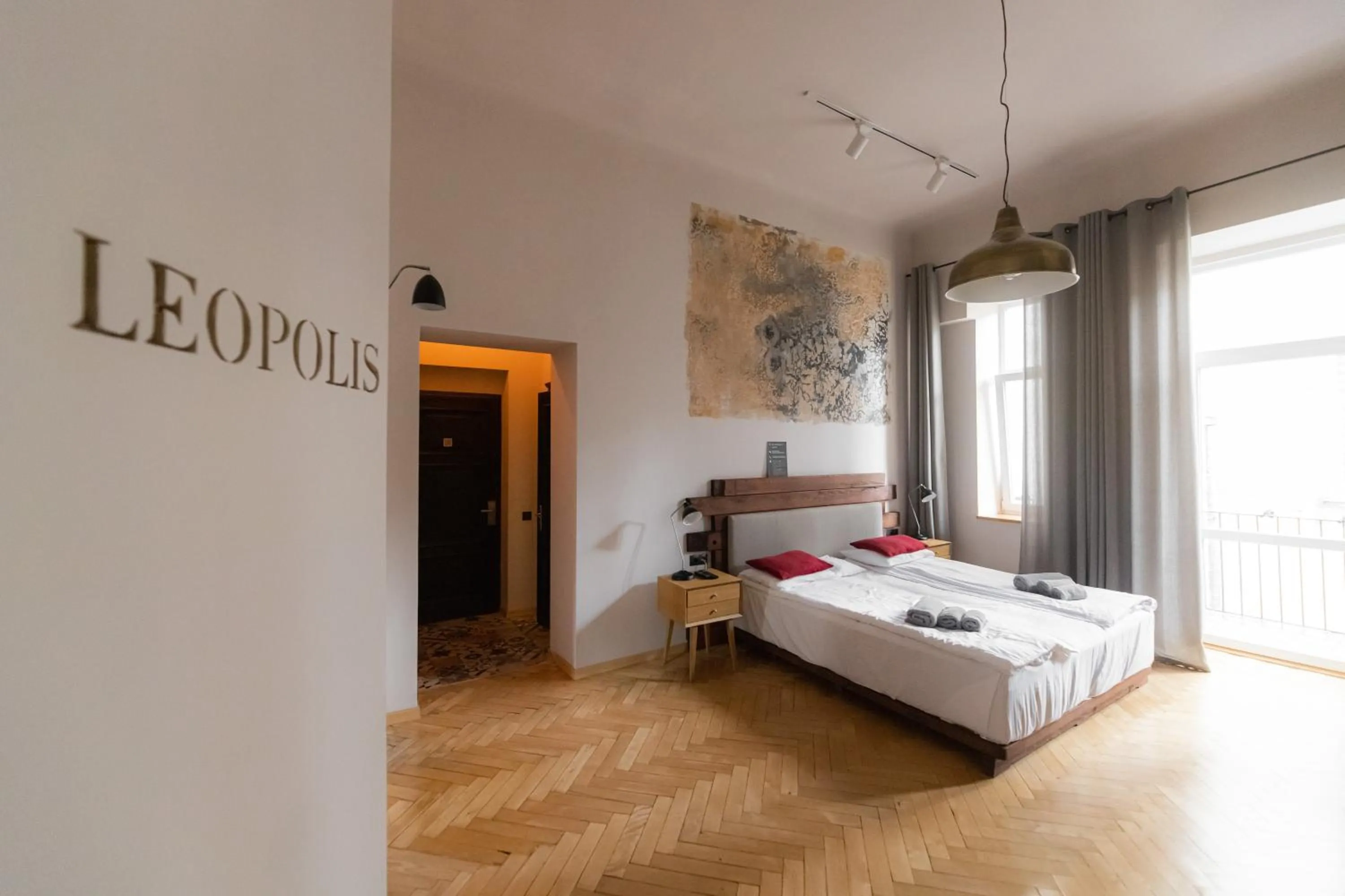 Bed in Apartments JustLvivIt at the Rynok Square
