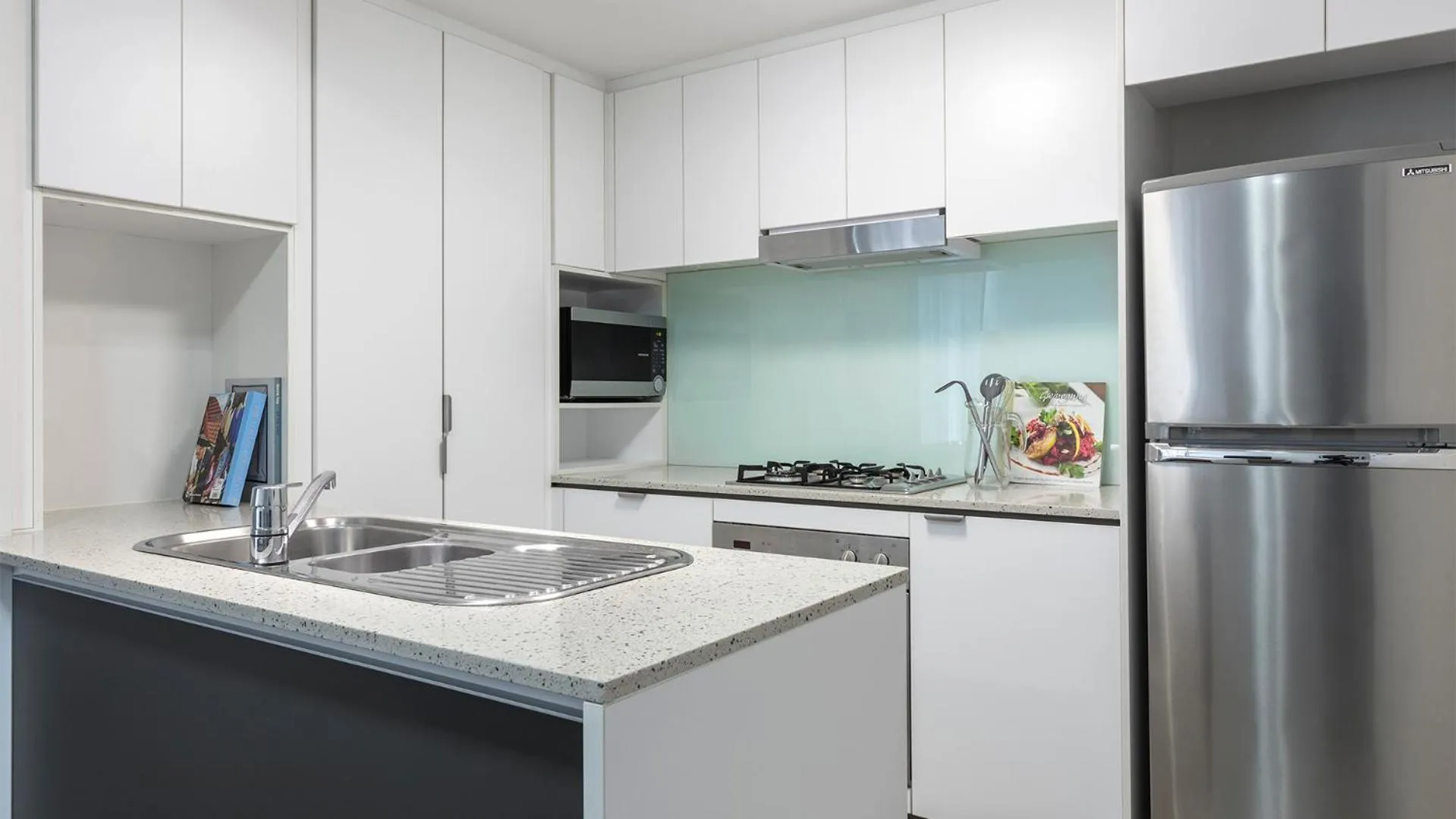 Kitchen or kitchenette in Oaks Brisbane Festival Suites