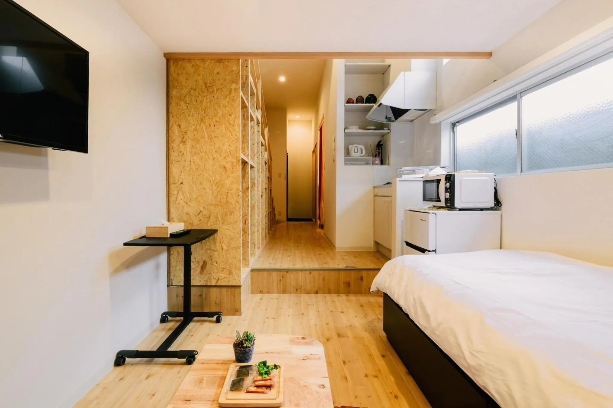 Bed in TEN APARTMENT HOTEL