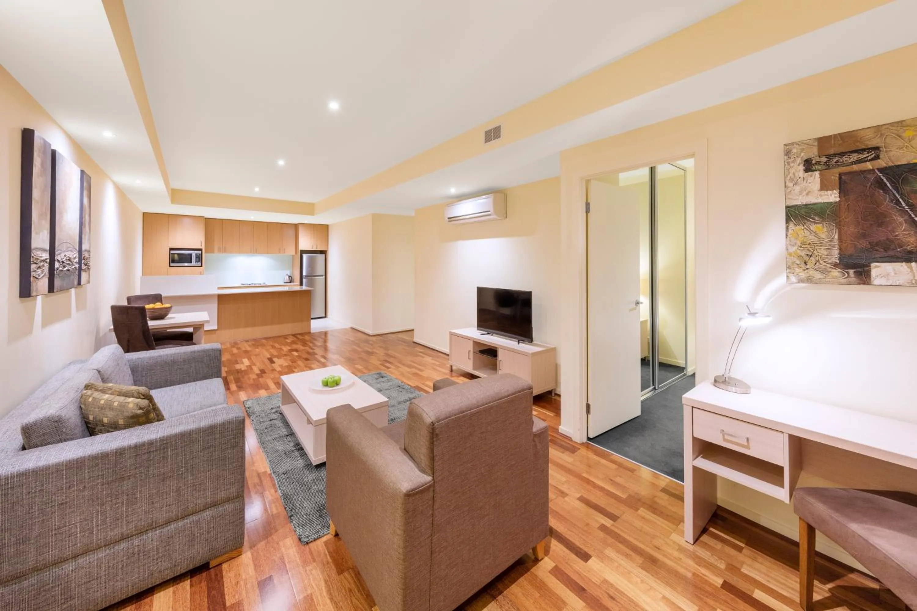 Living room, Bed in Oaks Melbourne on Lonsdale Suites