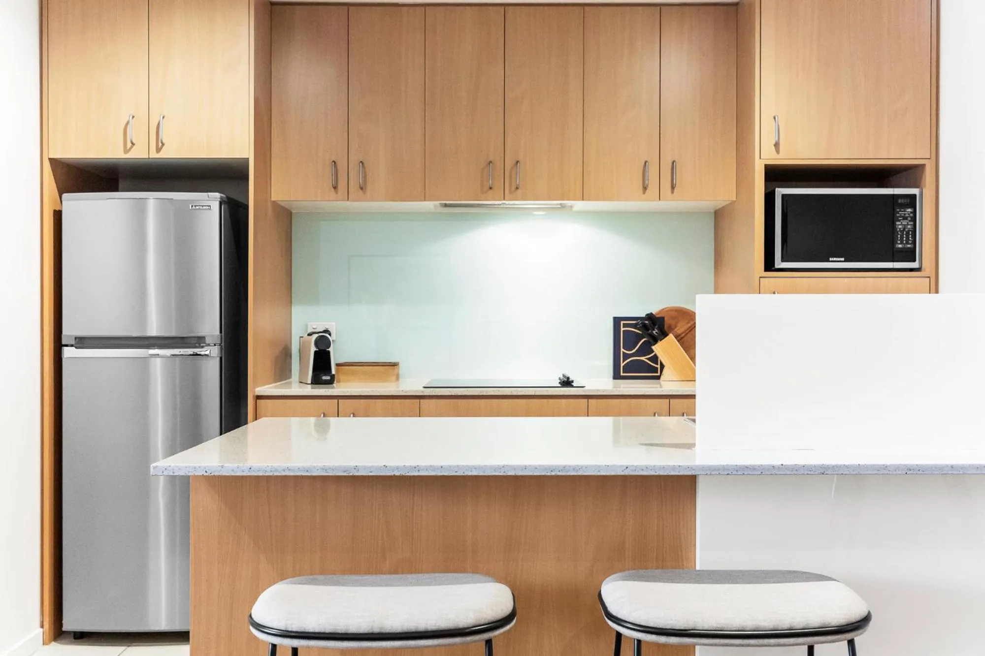 kitchen in Nolo Apartments Lonsdale St