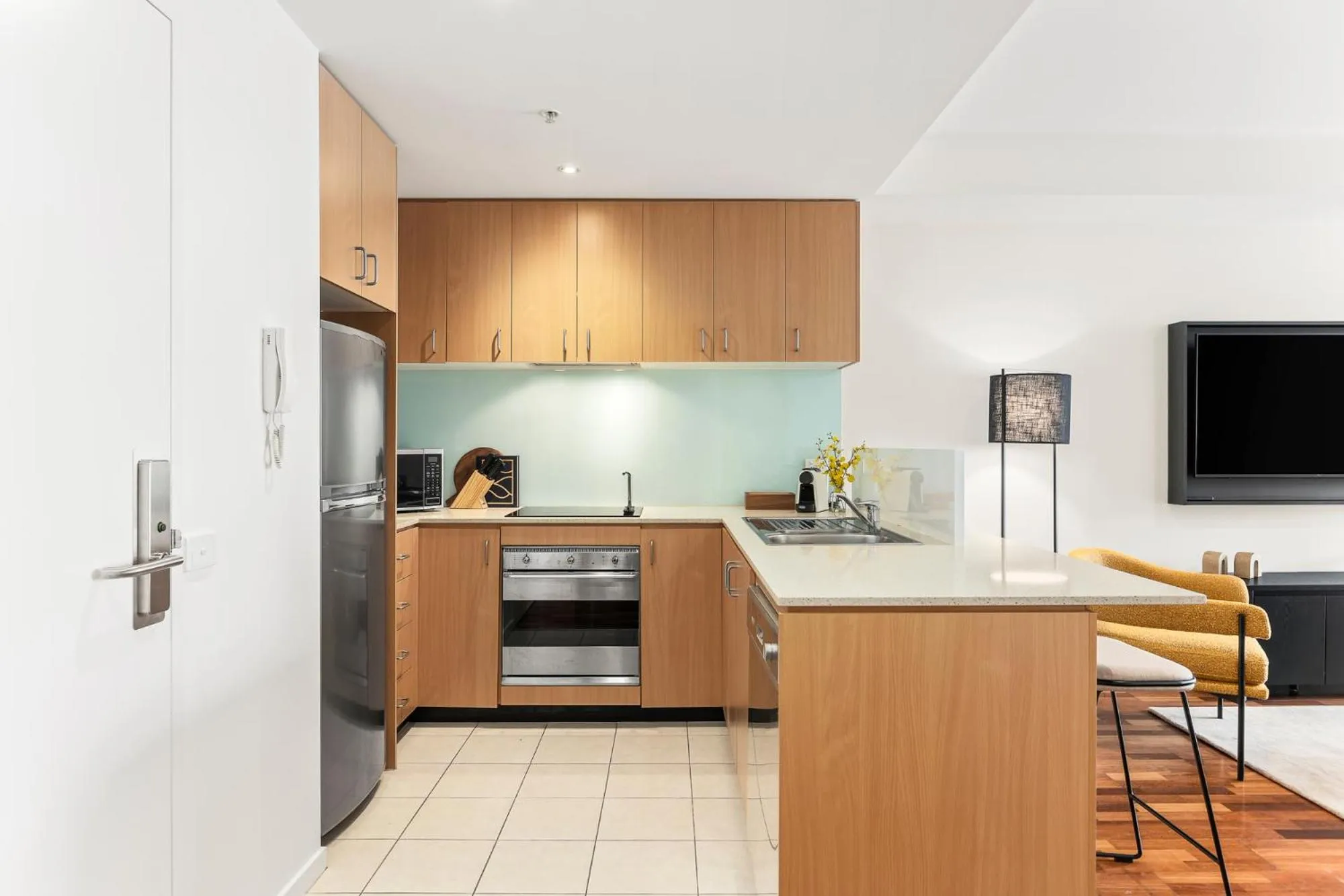 kitchen in Nolo Apartments Lonsdale St