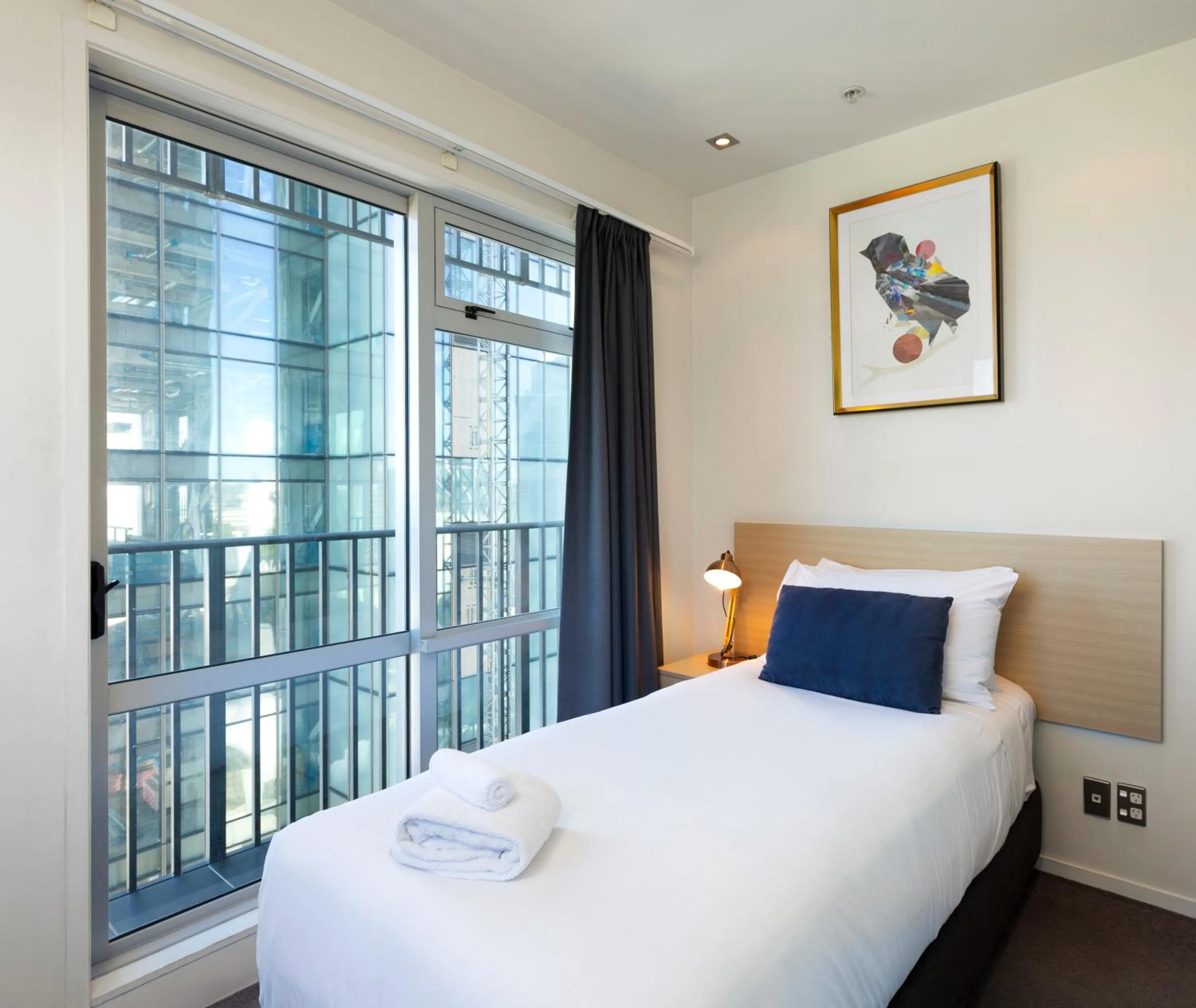 Bed in Auckland Harbour Suites