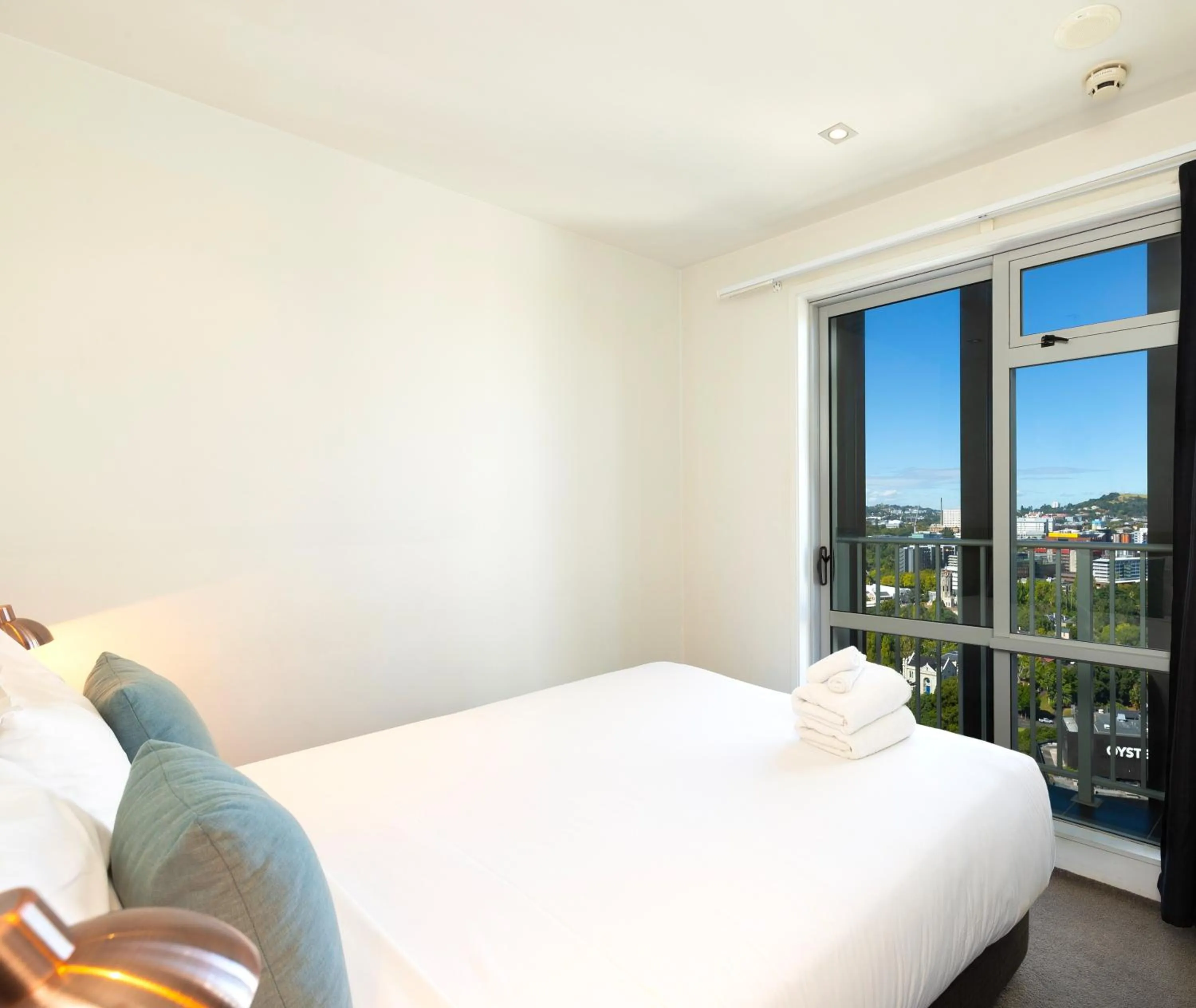 Bed in Auckland Harbour Suites