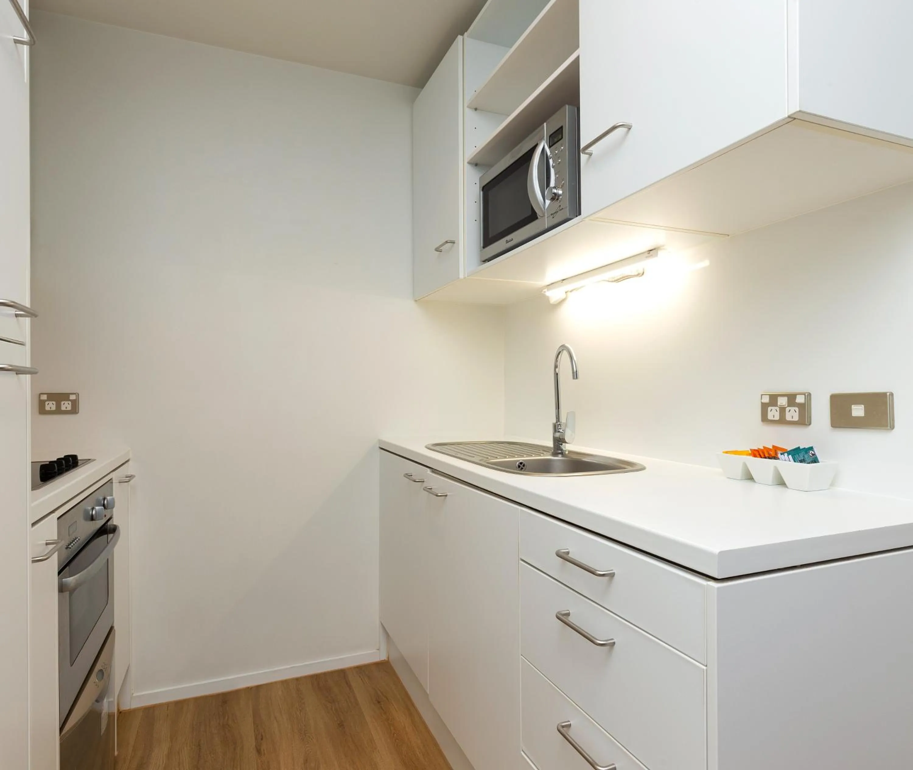 Kitchen or kitchenette in Auckland Harbour Suites