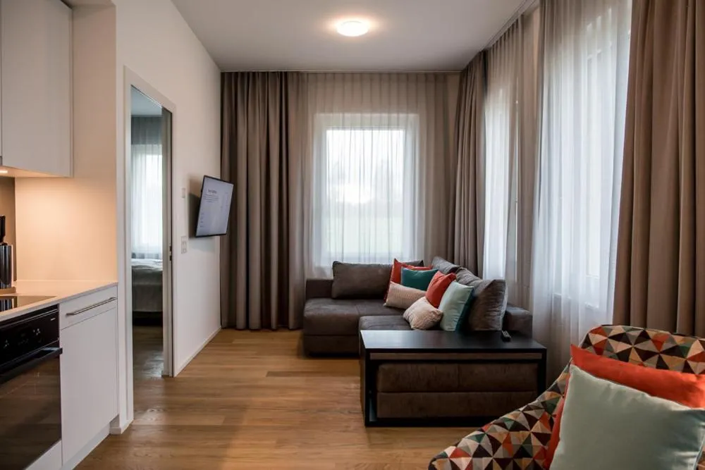 Communal lounge/ TV room in Aparthotel Luzern West