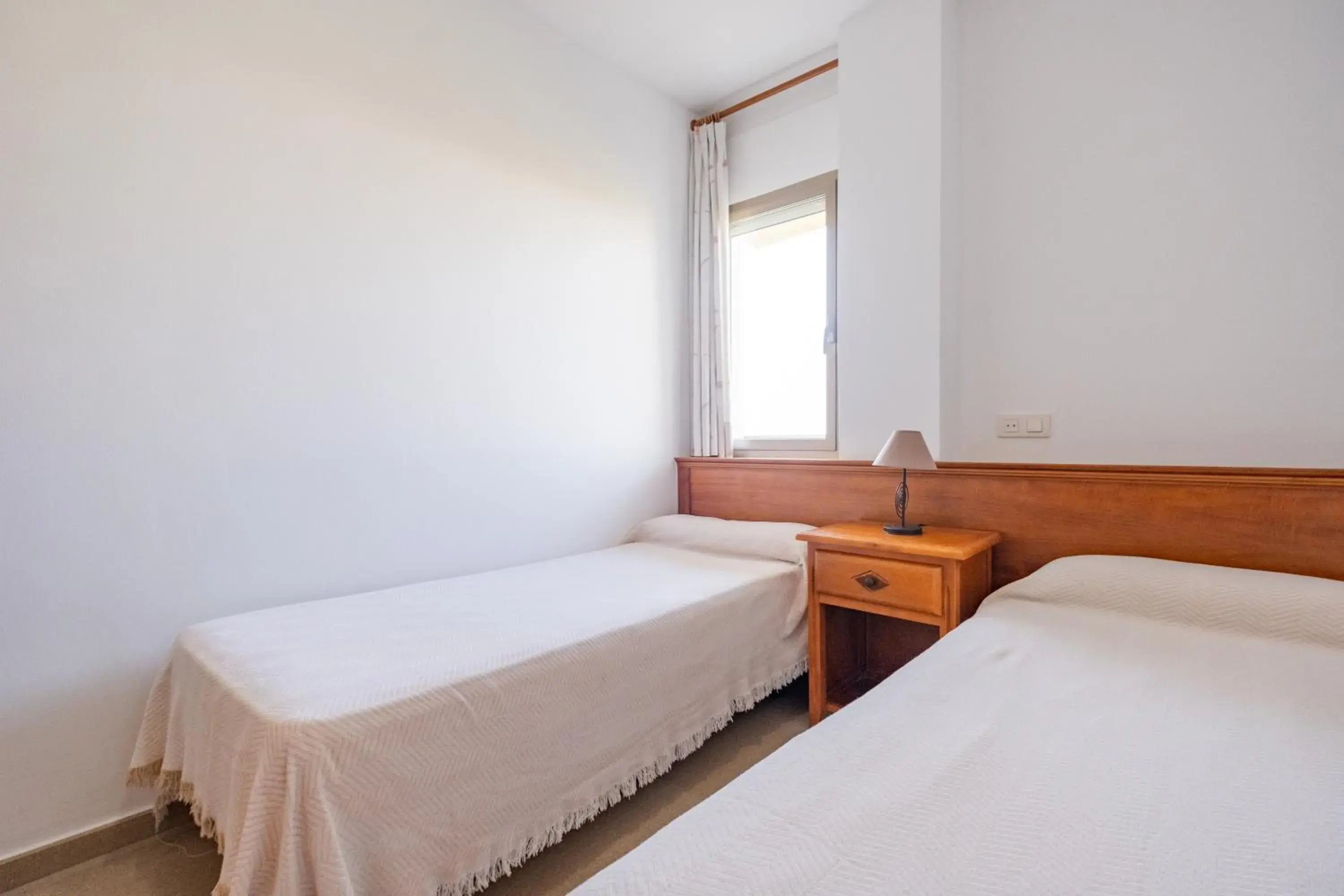 Bed in Apartamentos Proamar Bed in Apartamentos Proamar