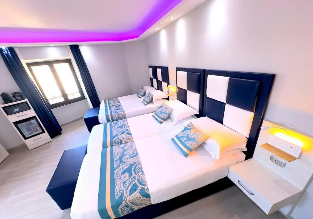 Luxury Quadruple Room in THE ONE Boutique Hotel & SPA Roma Luxury Quadruple Room in THE ONE Boutique Hotel & SPA Roma