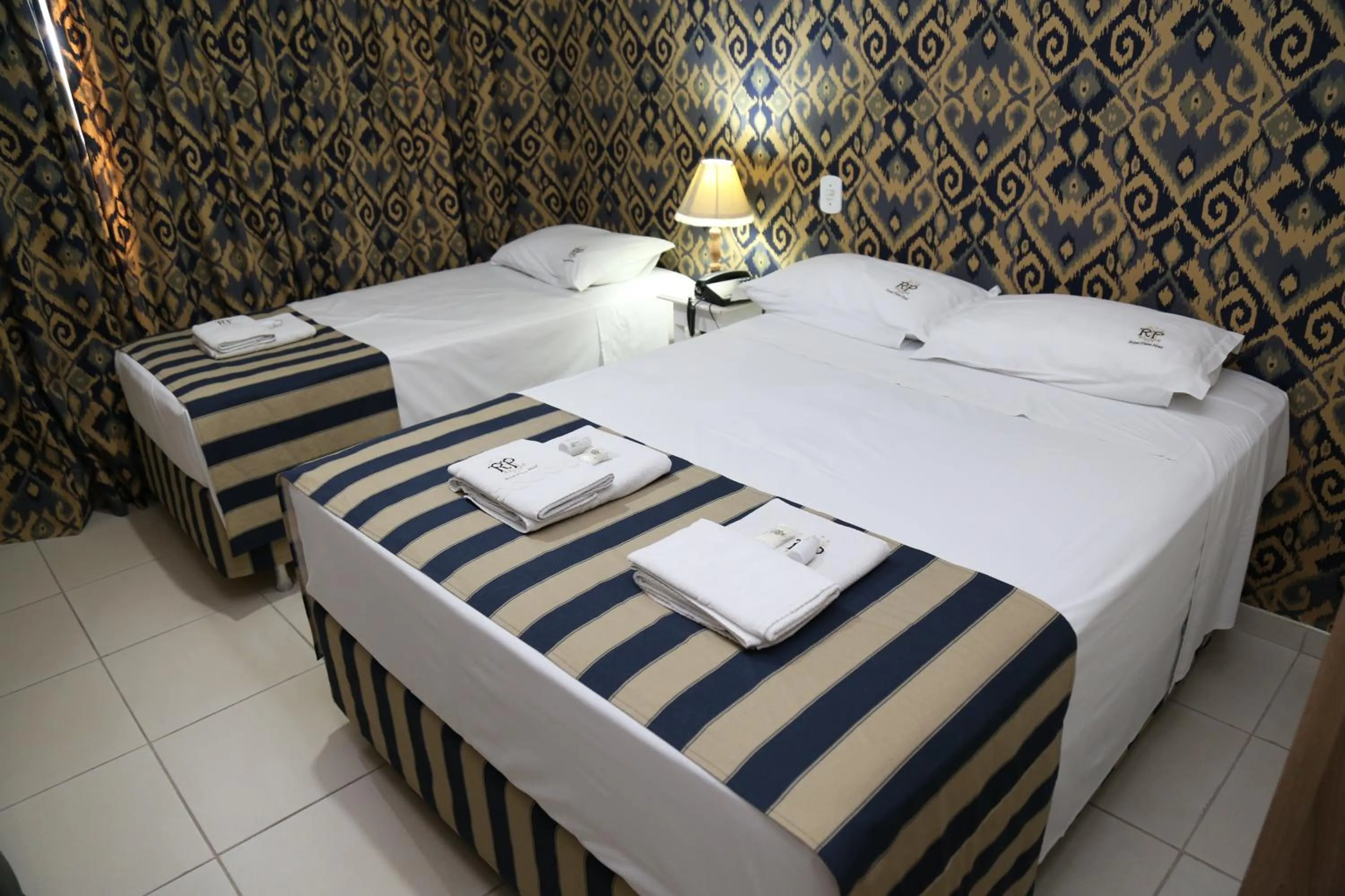 Bed in CHA Royal Plaza Hotel