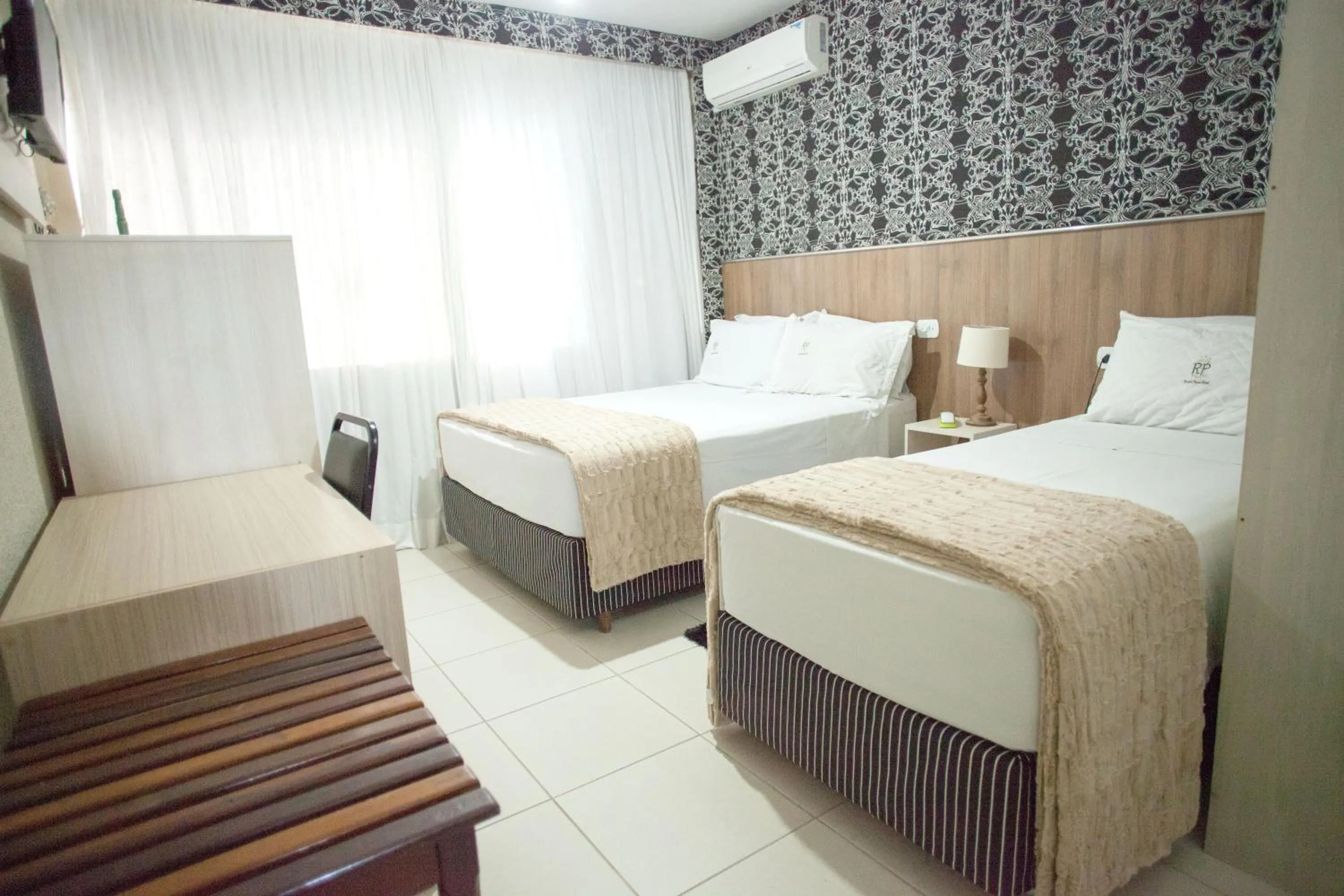 Bed in CHA Royal Plaza Hotel