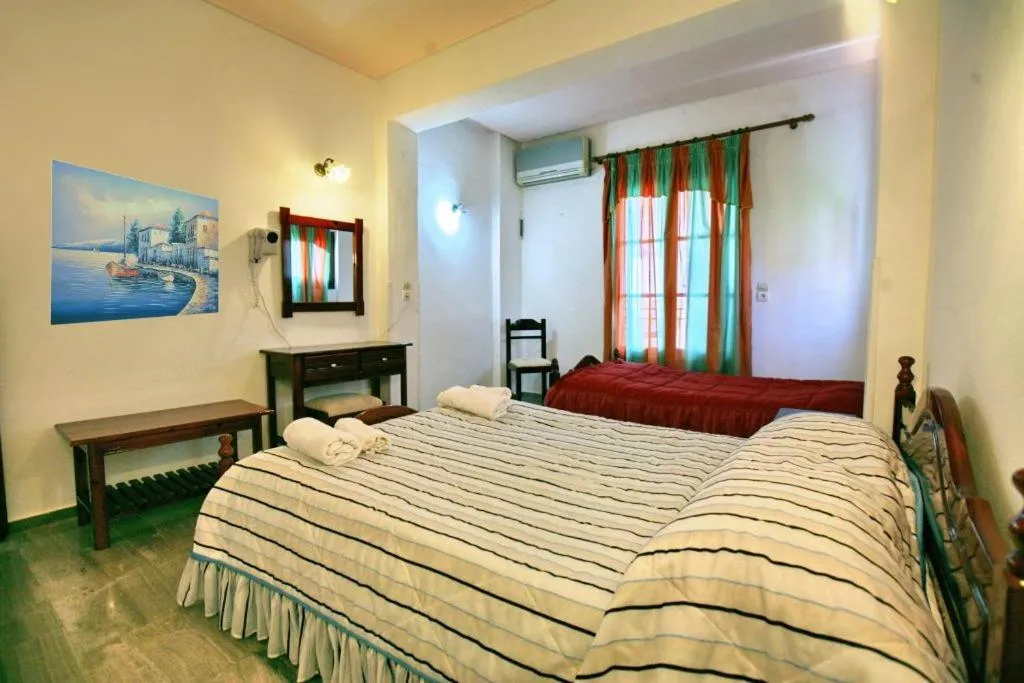 Bed in Theofilos Classic Hotel