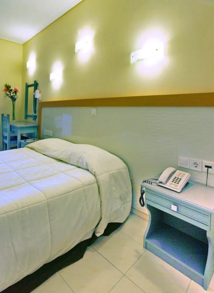 Bed in Theofilos Classic Hotel
