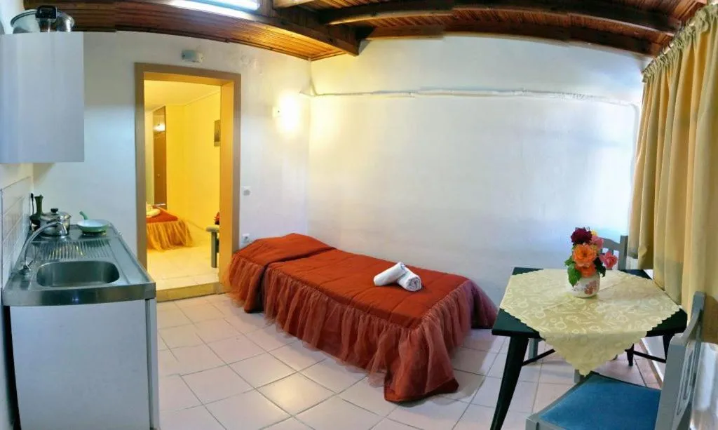 Bed in Theofilos Classic Hotel