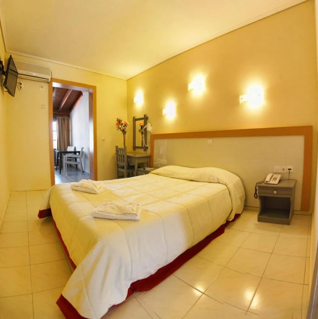 Bed in Theofilos Classic Hotel