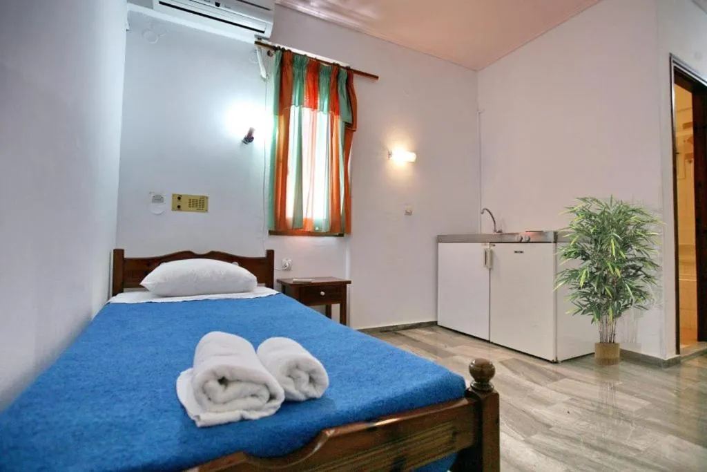Bed in Theofilos Classic Hotel
