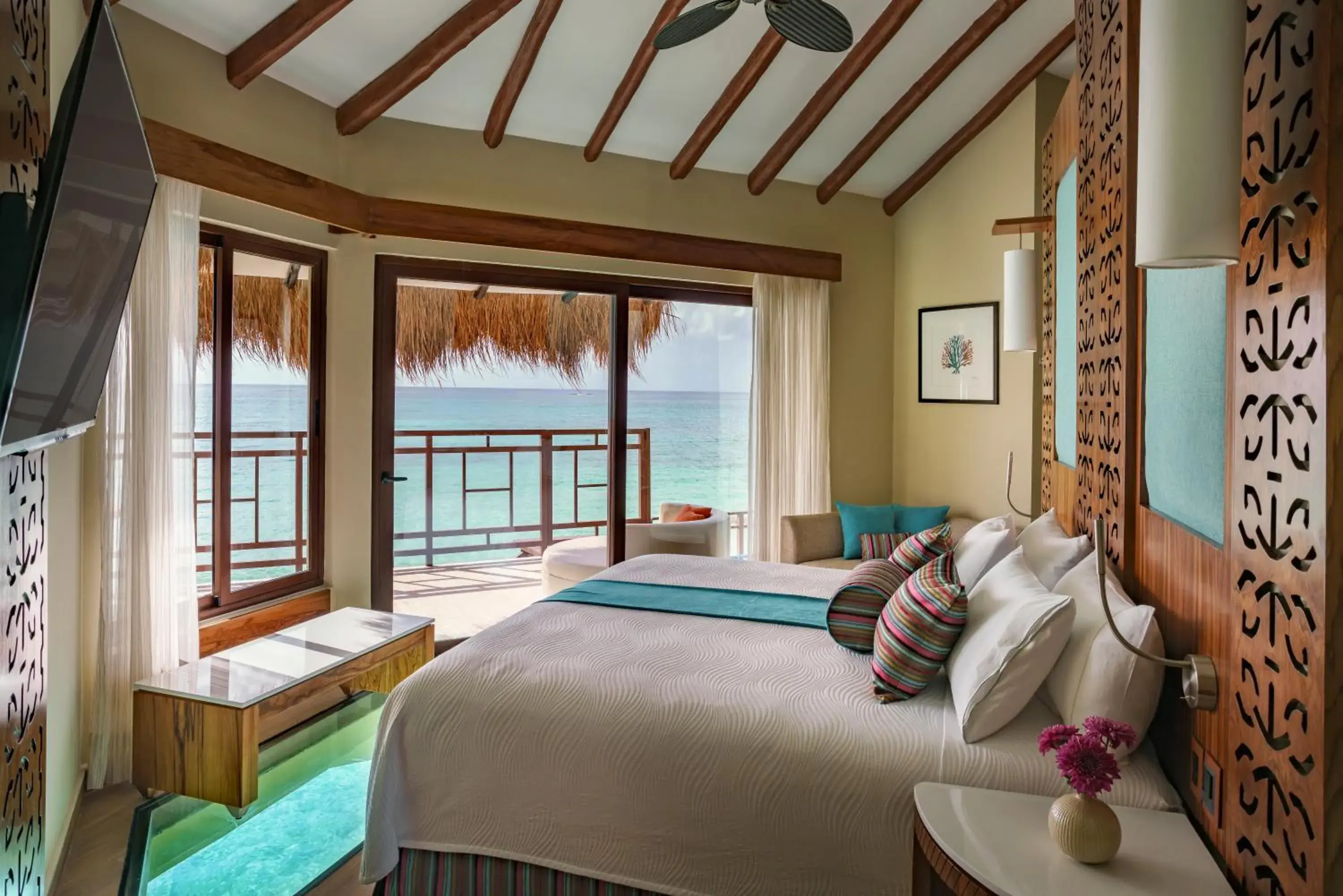 Bed in Palafitos Overwater Bungalows, All & More Inclusive - Adults Only Bed in Palafitos Overwater Bungalows, All & More Inclusive - Adults Only