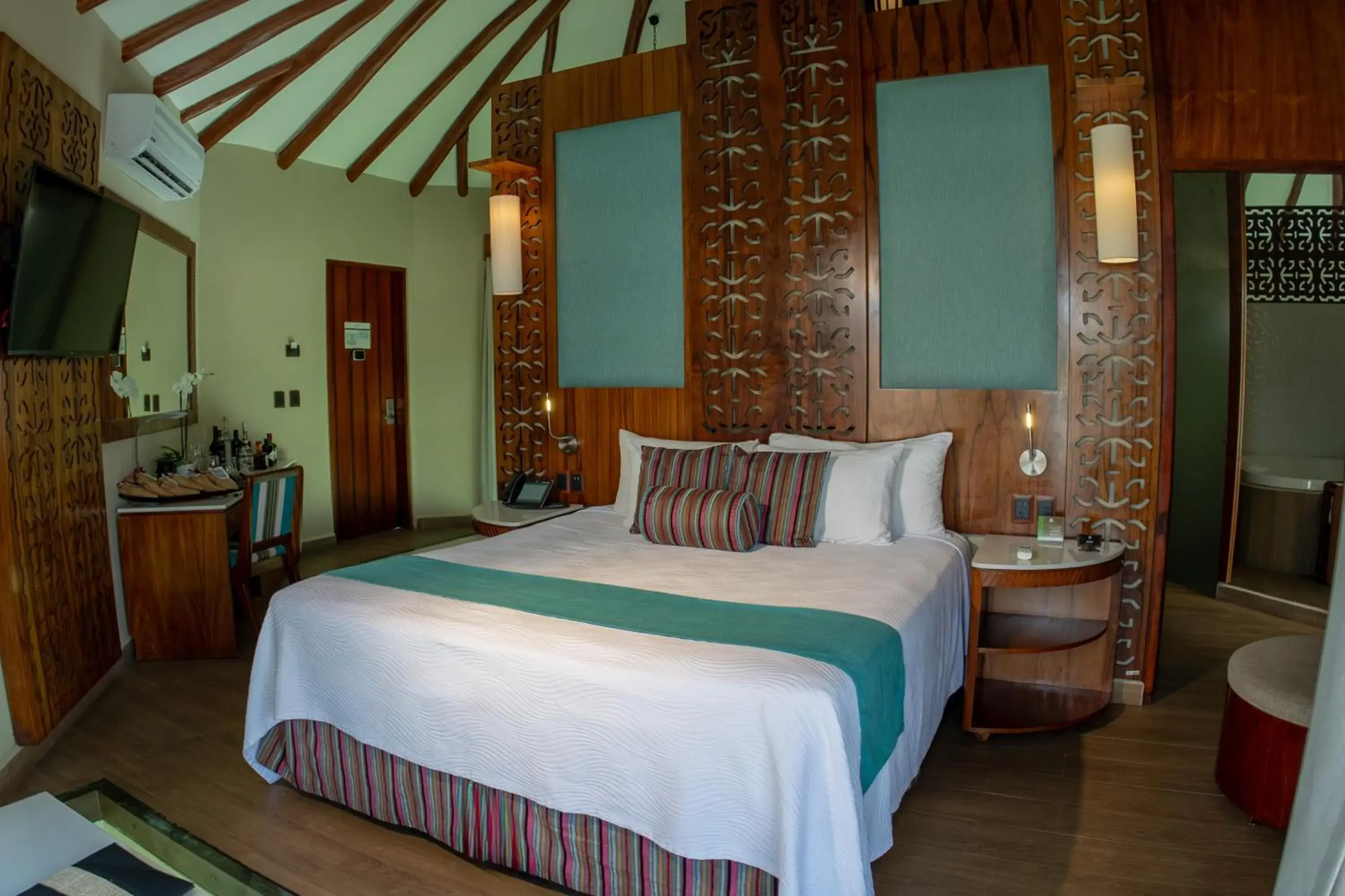 Bed in Palafitos Overwater Bungalows, All & More Inclusive - Adults Only Bed in Palafitos Overwater Bungalows, All & More Inclusive - Adults Only