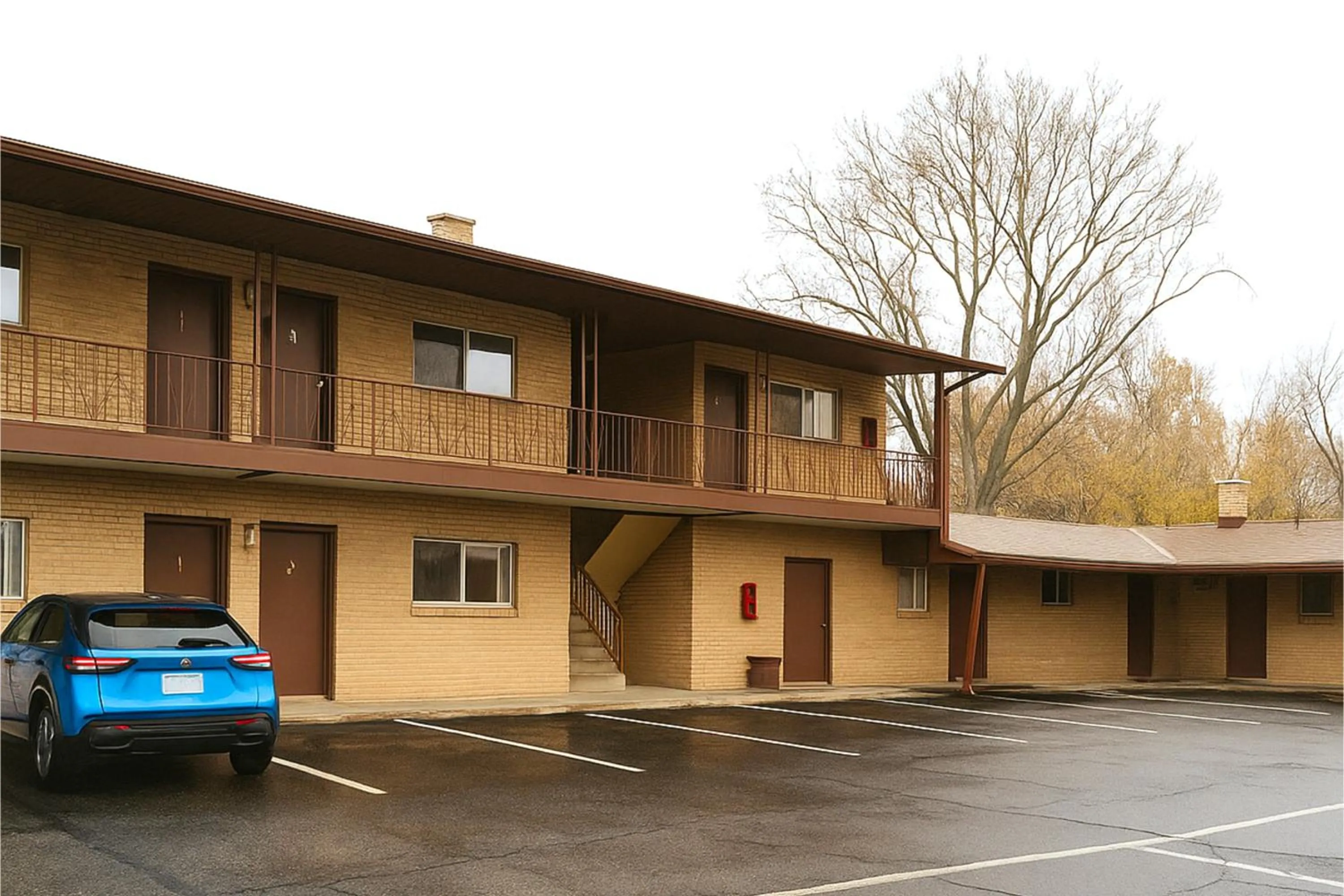 Property building in Capital O Swan Inn Comstock Park