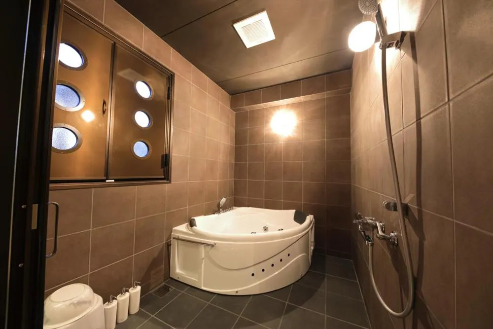 Shower in Terrace Garden Mihama Resort by Coldio Premium