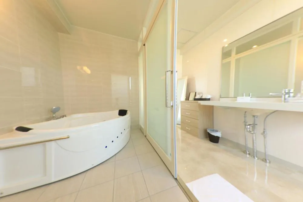 Shower in Terrace Garden Mihama Resort by Coldio Premium